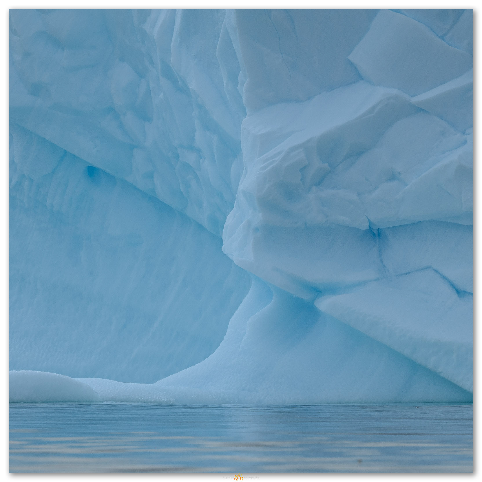 Tipping. An iceberg rotates as it melts in the coastal waters of Antarctic Peninsula