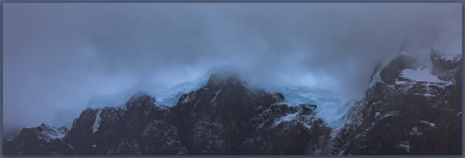Hanging blue. The hanging glaciers of French Valley peak from the storm, Torres del Paine National Park, Chile