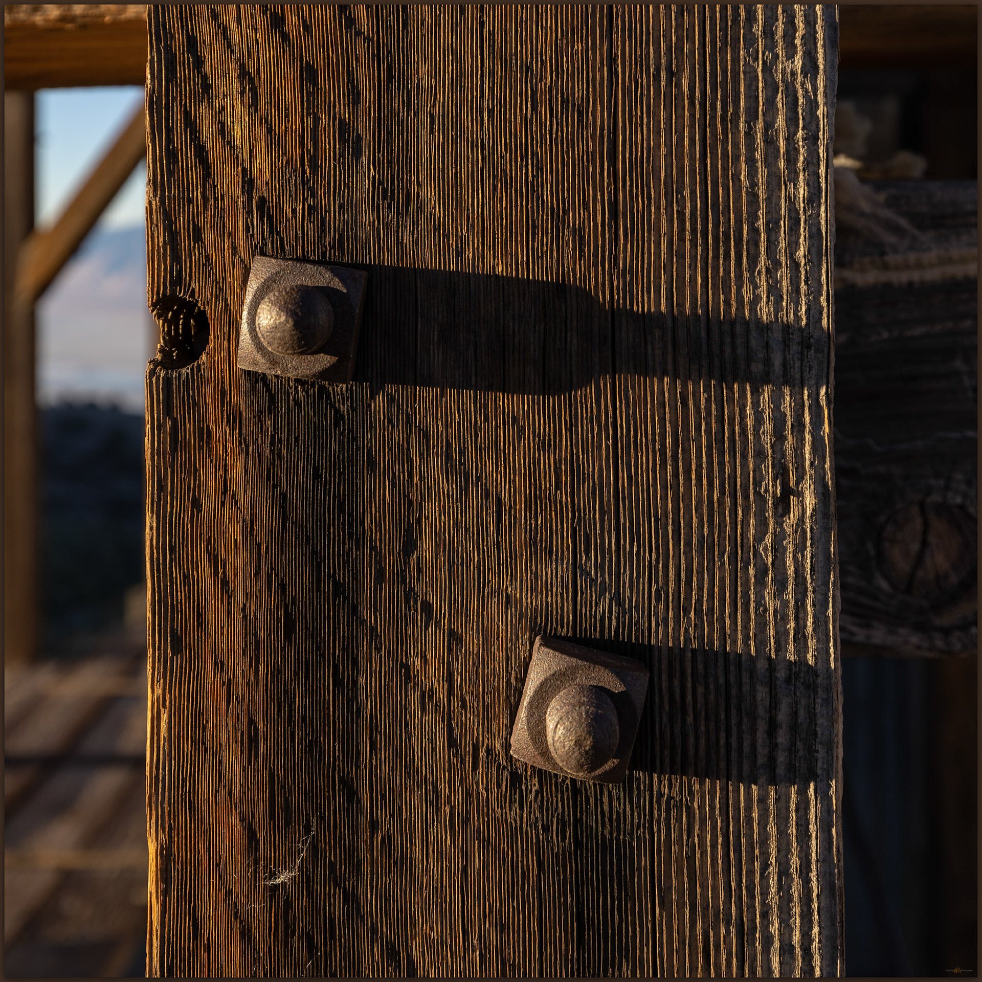 Nuts and bolts. Morning light on the hardware and wood of the salt tram, Inyo Mountains, CA, USA