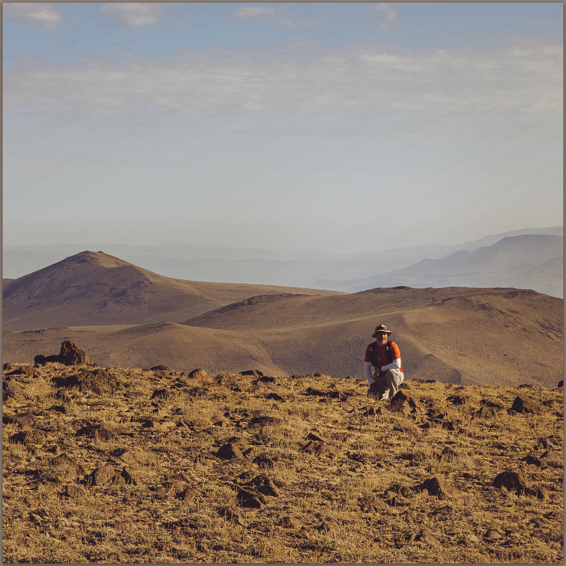 Darren waits on a small rimrock plateau in the northern Calico Mountains, Great Basin Desert, USA