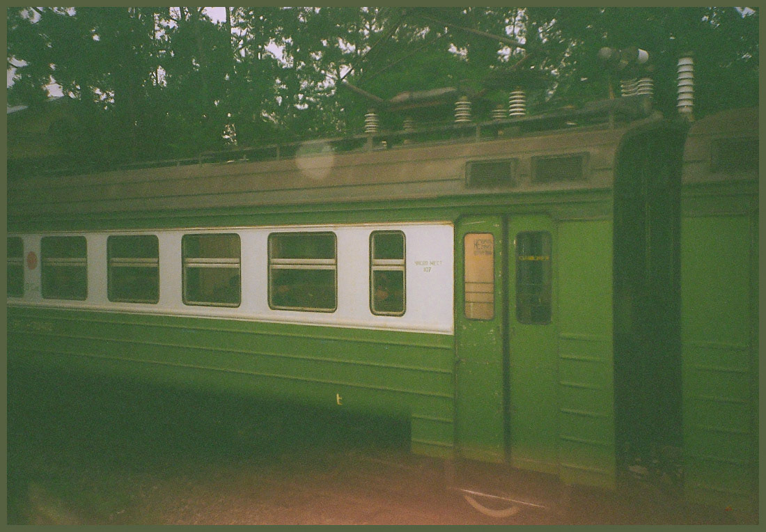 Windows. A commuter passes the Tran Siberian Railway, Lake Baikal, Russia