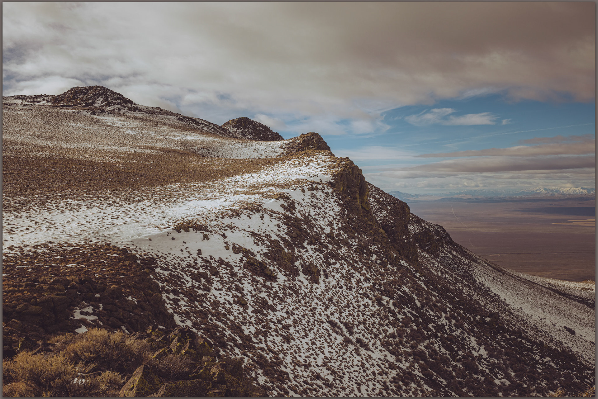 Trinity ridge leading from a false summit outcrop. Great Basin Desert, NV, USA
