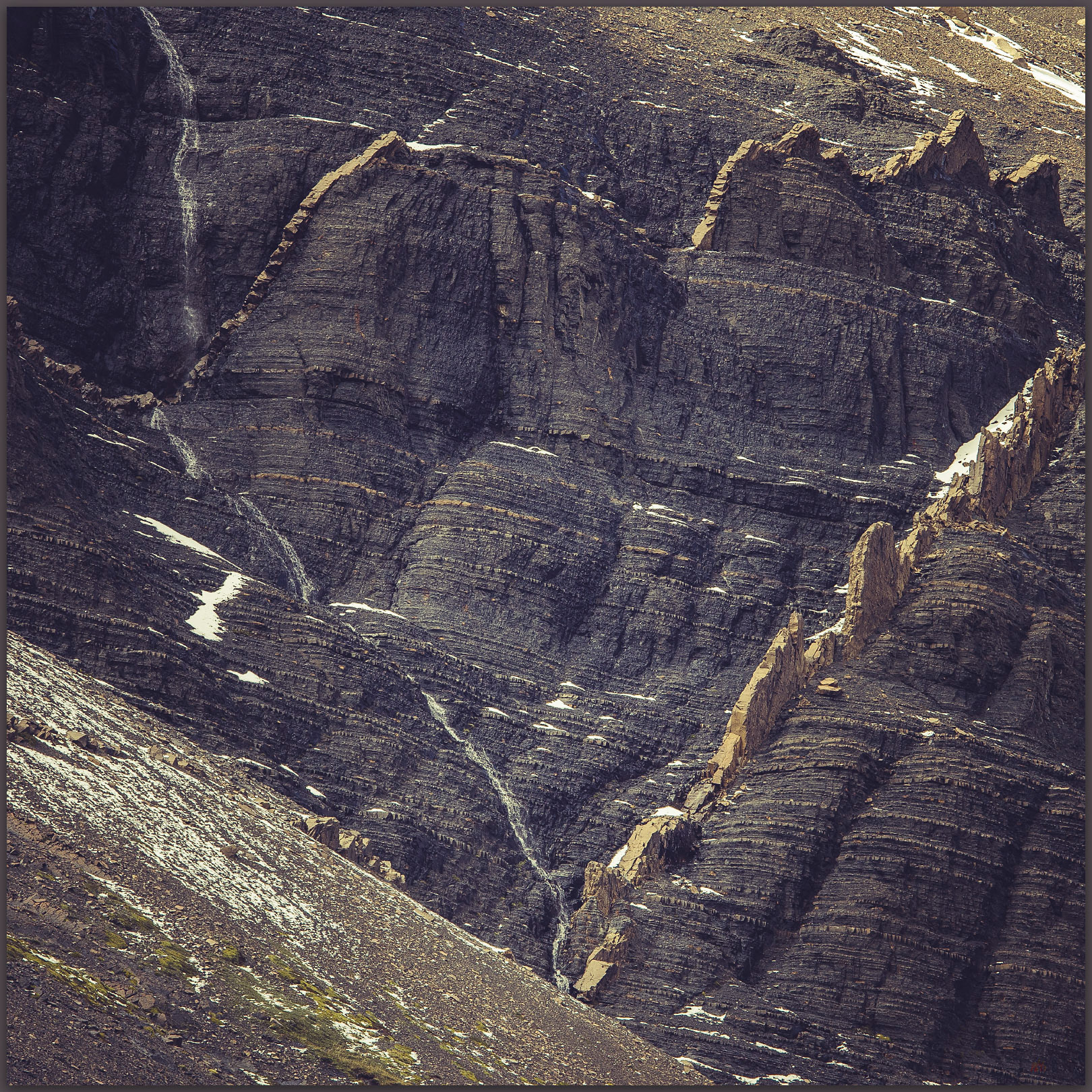 Fissured. Igneous dikes break the pattern in the meta-sedimentary rocks of Rio Ascencio, Torres del Paine National Park, Chile