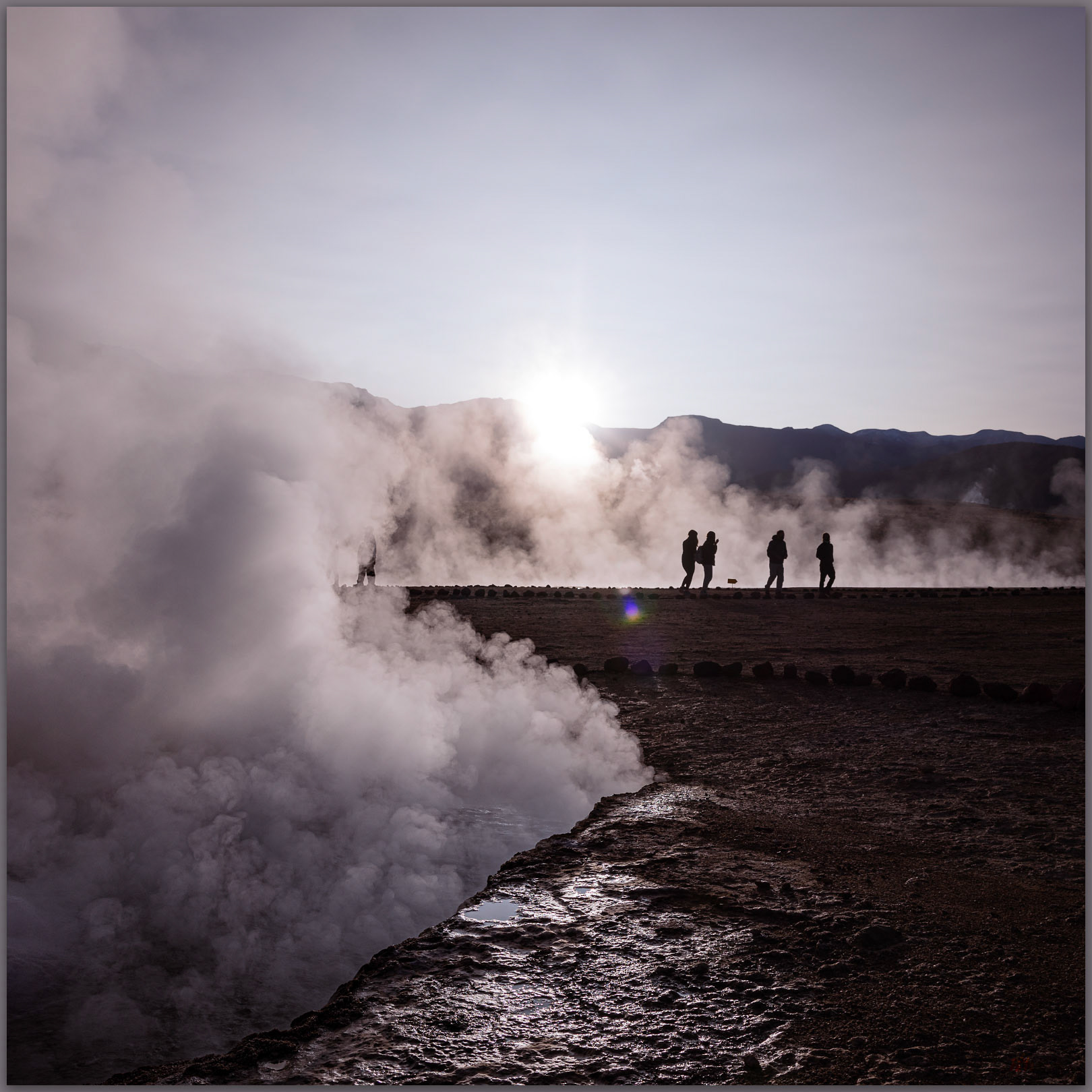 Early arrival. Visitors at dawn at the El Tatio Geysers, Atacama Desert, Chile