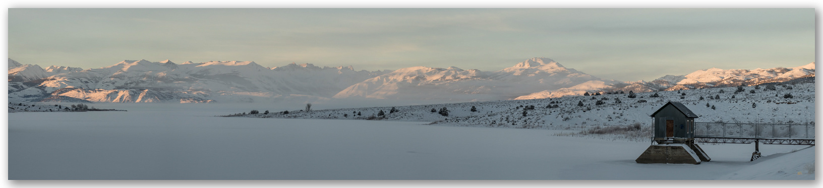Frozen.  Inversion fog forms misty strata above Bridgeport Reservoir, eastern Sierra, CA, USA.