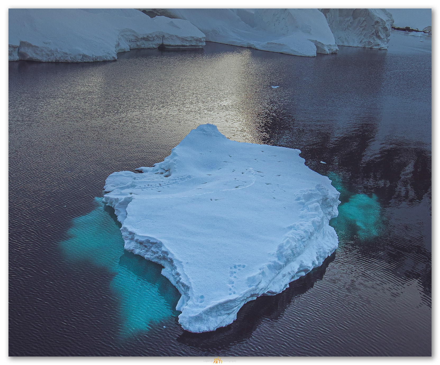 Stopover. Traces of overnight stay on iceberg in Antarctic Peninsula
