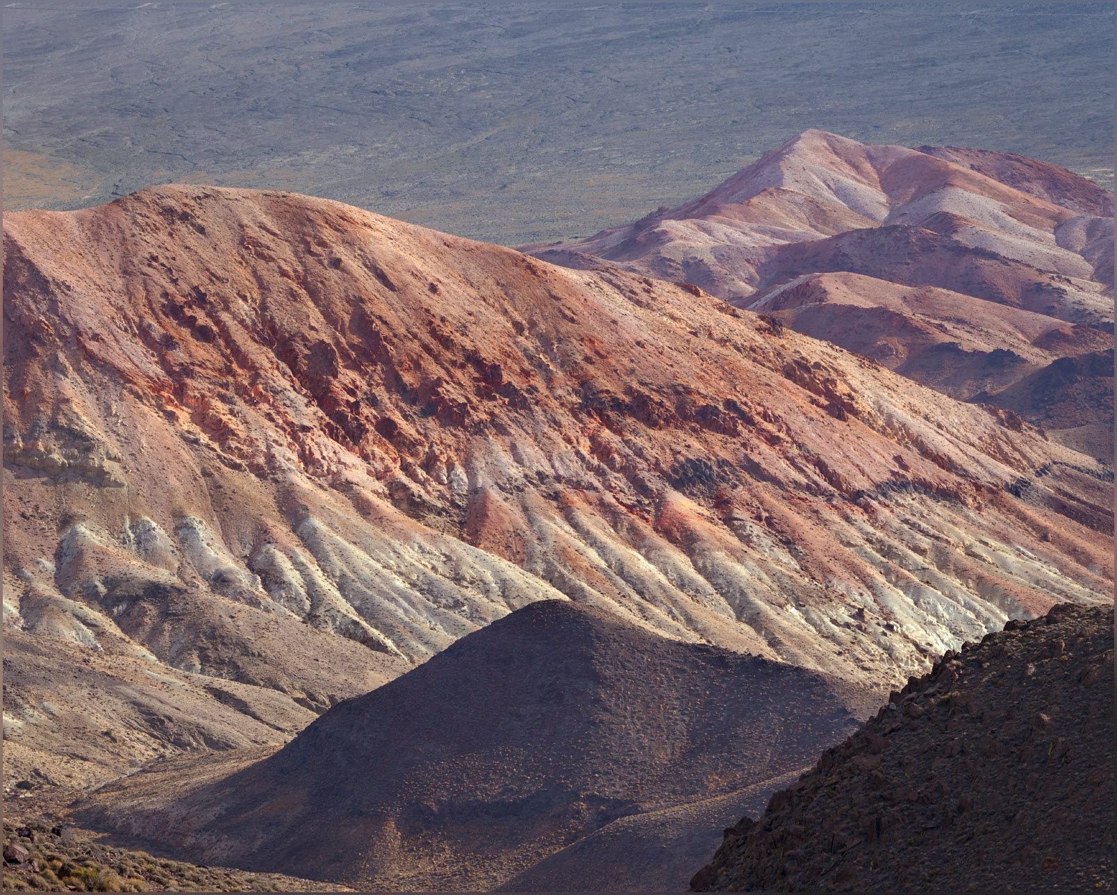 Red hills. Volcanic tuffs and minor lavas decorate the hills on the eastern margin of the Monte Cristo Range, Great Basin Desert, NV, USA