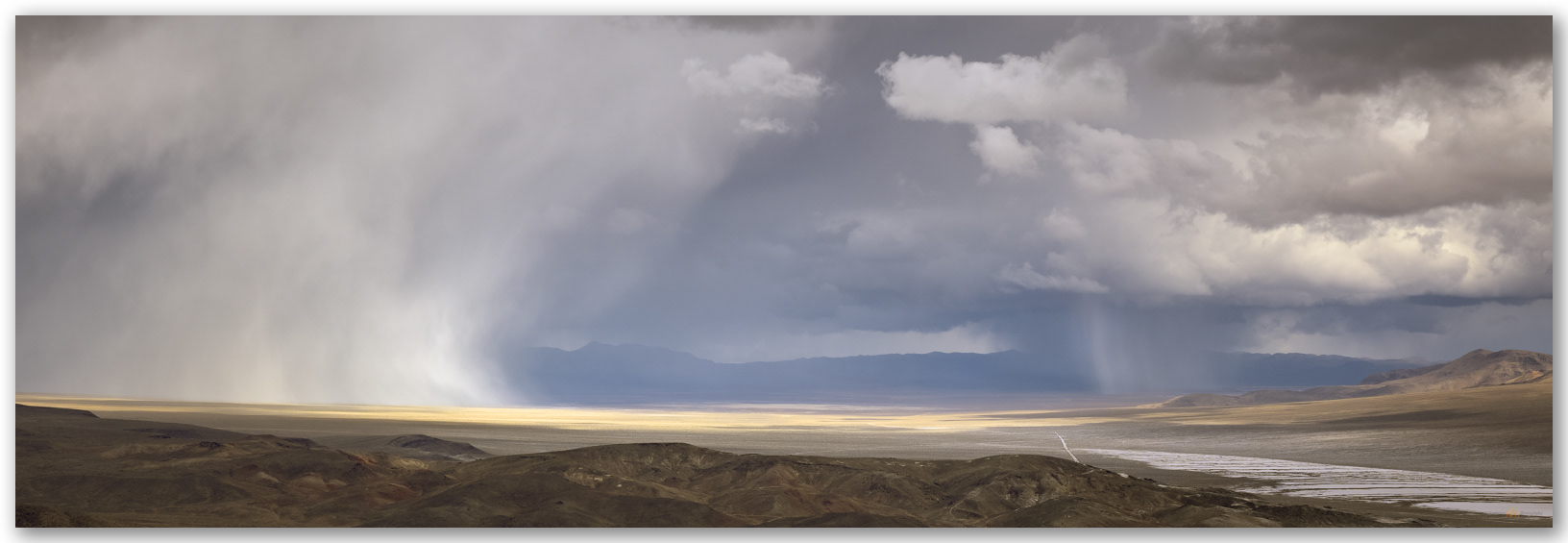 Torrential graupel storms track across Stonewall Valley toward Mud Lake playa, Cuprite Hills, Mojave Desert, Nevada, USA