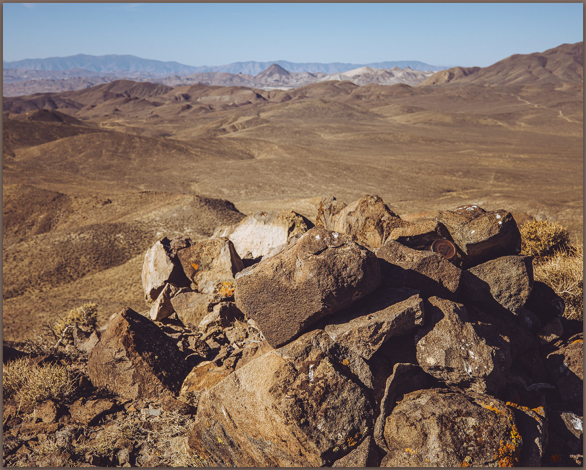 Summit cairn. Summit cairn and register jar at the top of Peak 6399, Sinkavata Hills, Great Basin Desert, Nevada, USA