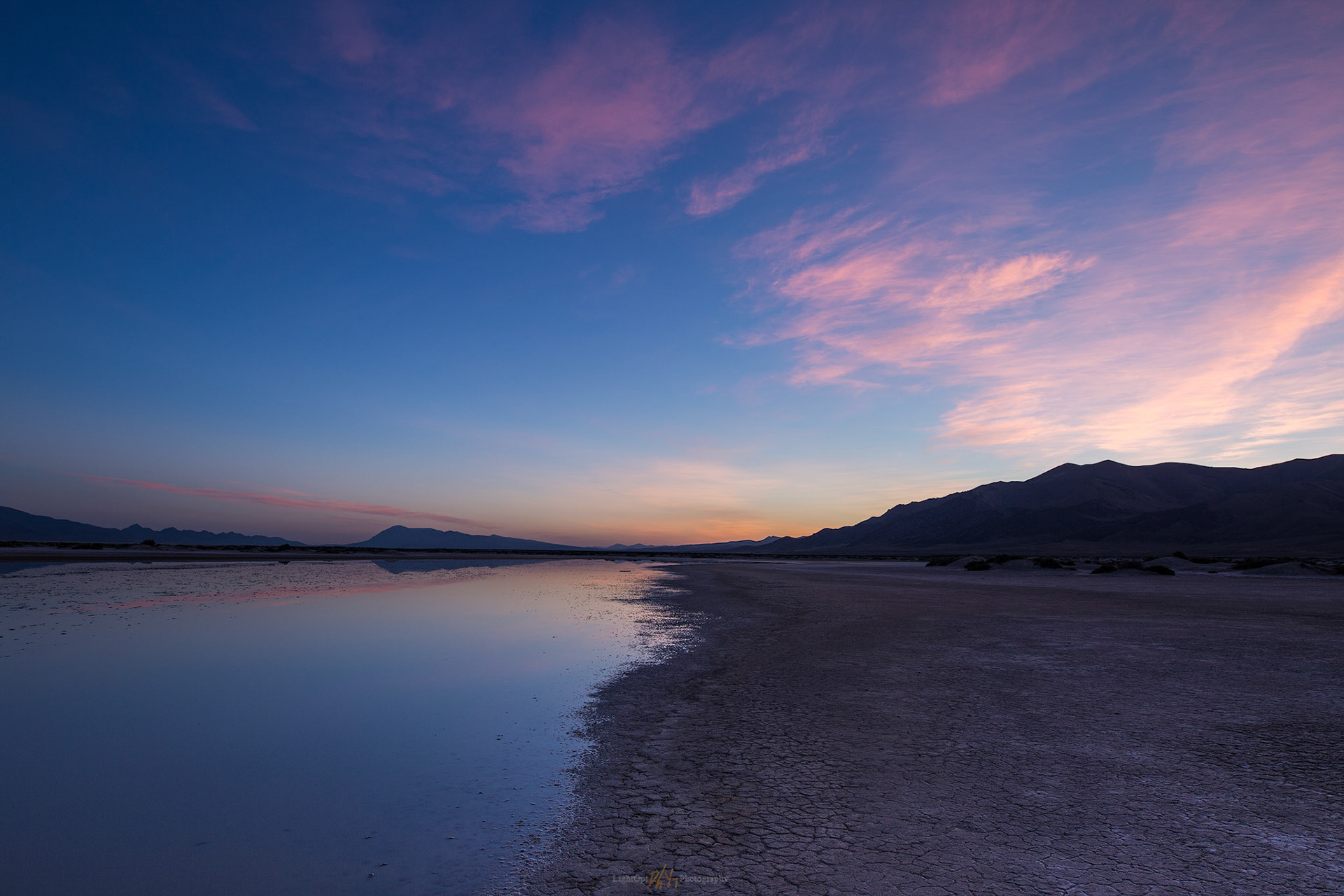 Receding dawn. The playa pool is almost as ephemeral as the colors of sunrise, Grass Valley, Great Basin Desert, NV, USA