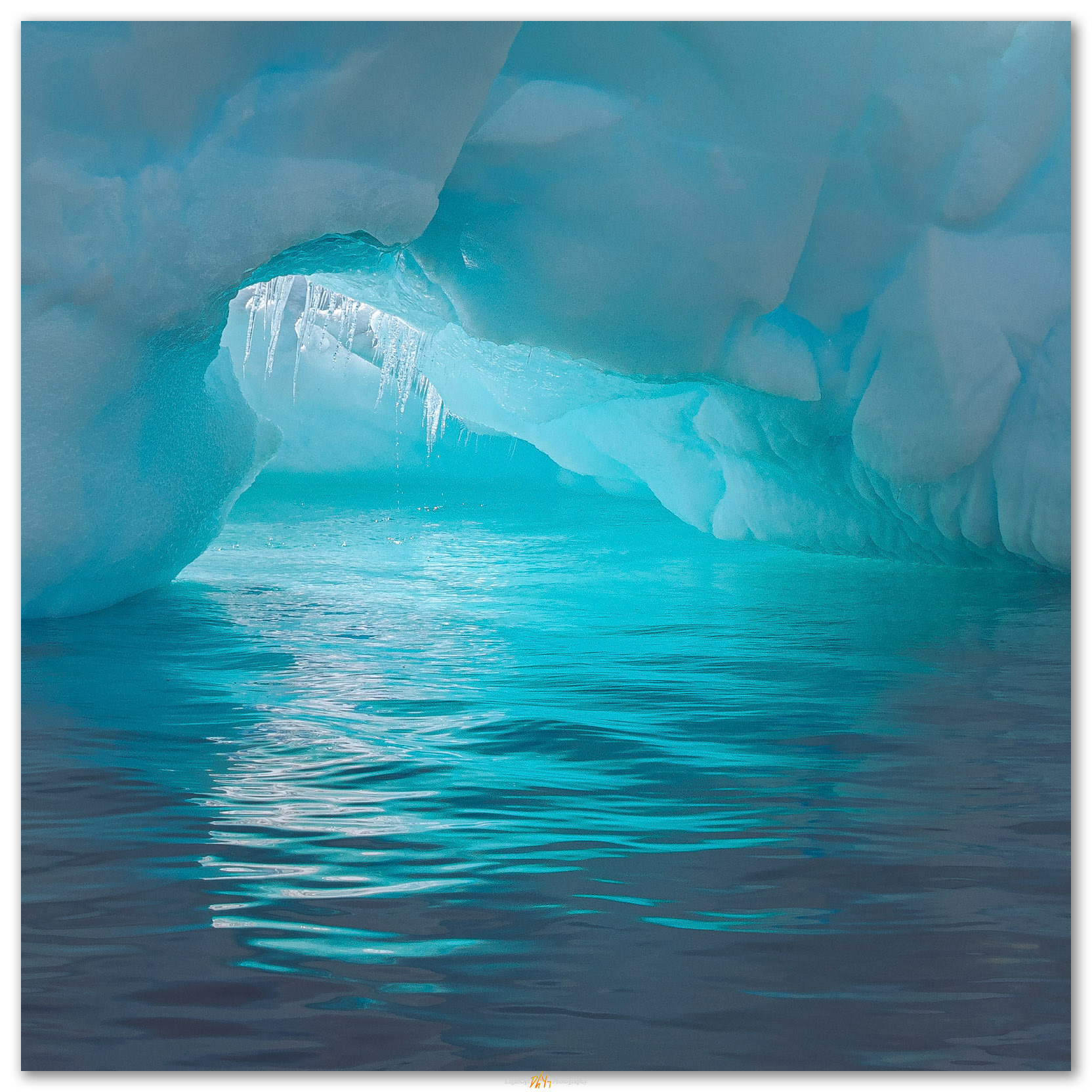 Tipping point. Icicles betray the rotation of a wandering iceberg off the Antartic Peninusla.