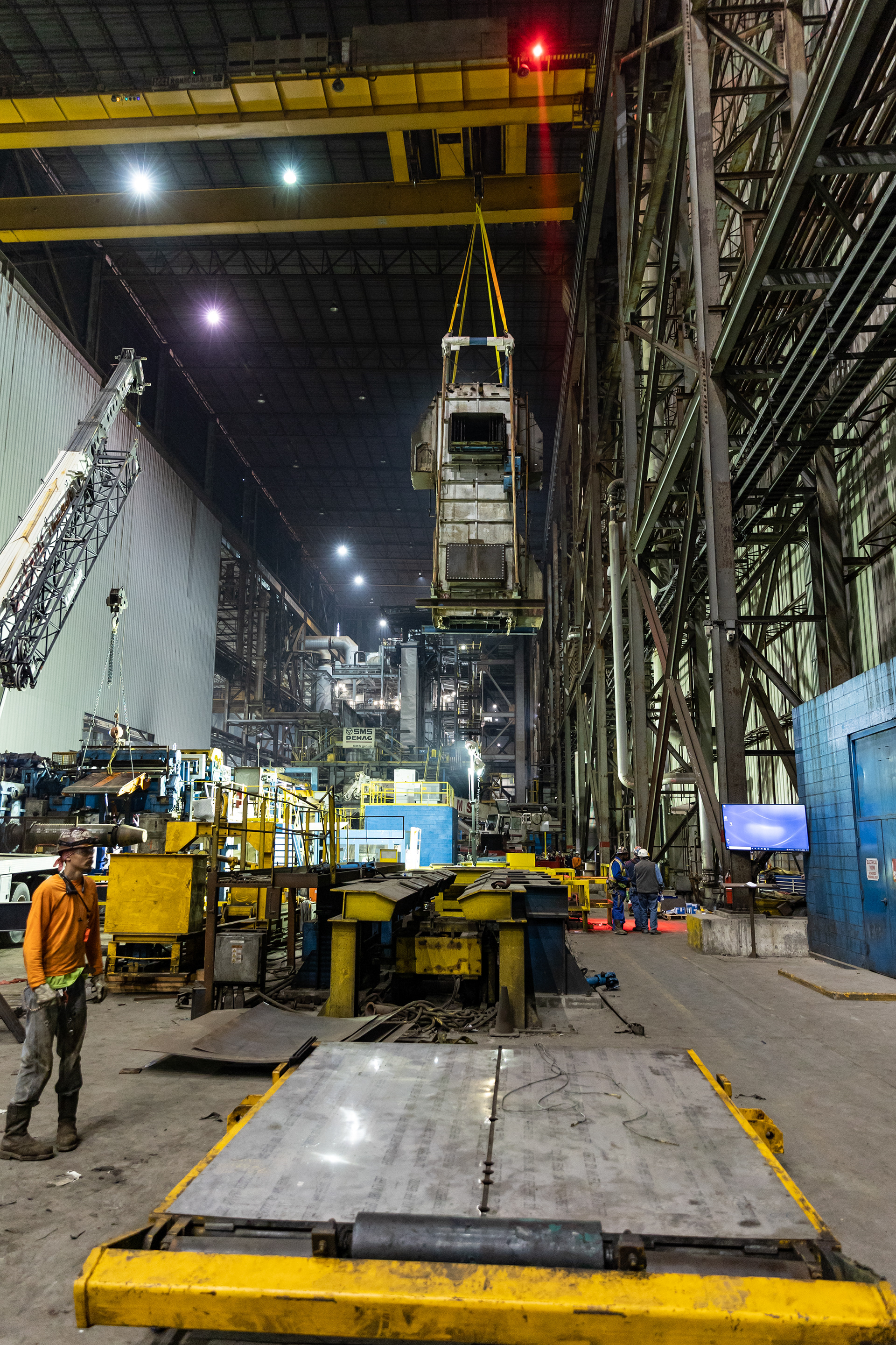 a wide shot of a working warehouse with large Barnhart construction materials