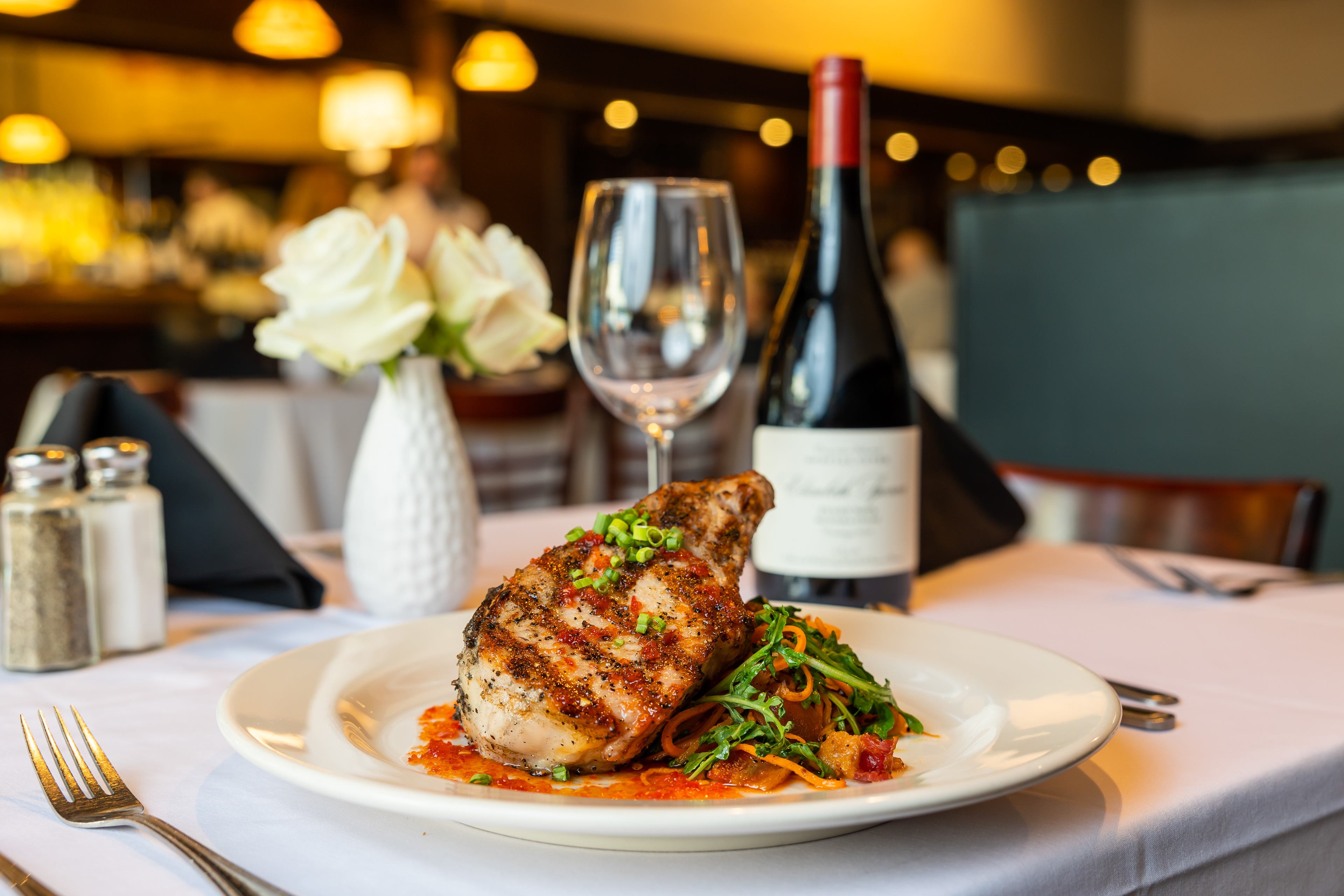 a tight shot of a dinner and wine at Cafe 123 Opelika Alabama