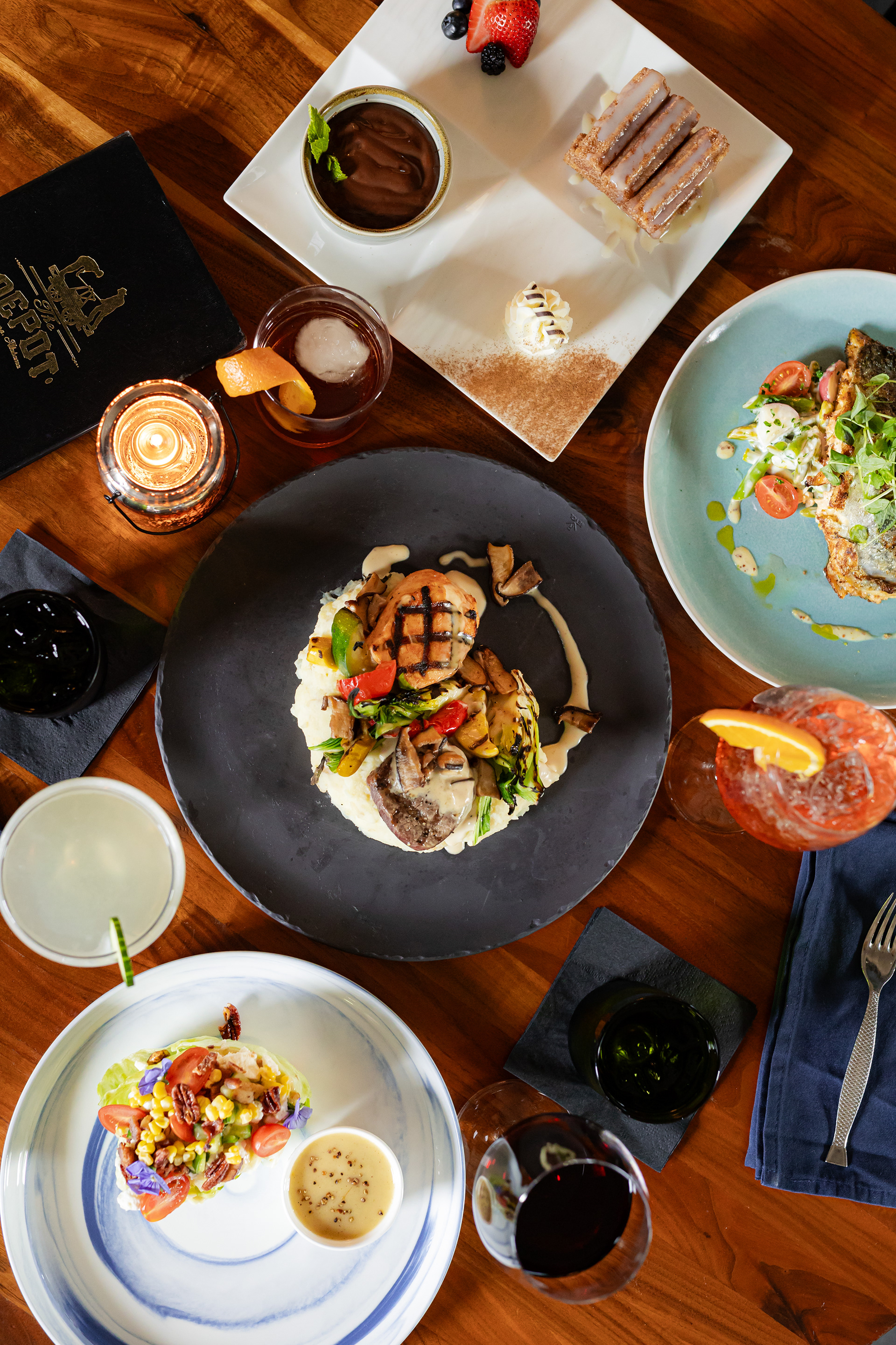 spread of appetizers, desserts, salads, drinks, and dinner from The Depot Auburn AL