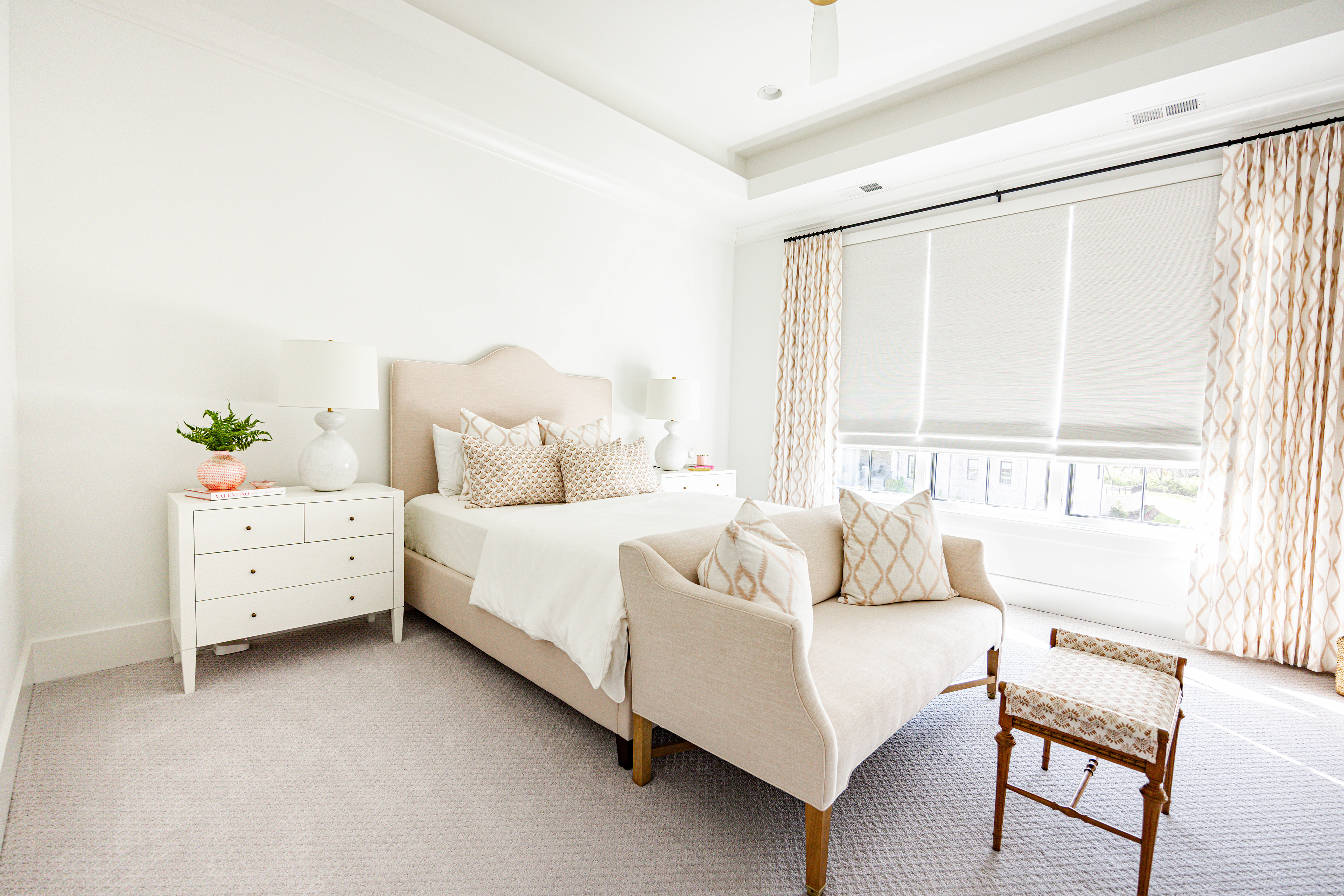 white and champagne bedroom, natural light and large windows