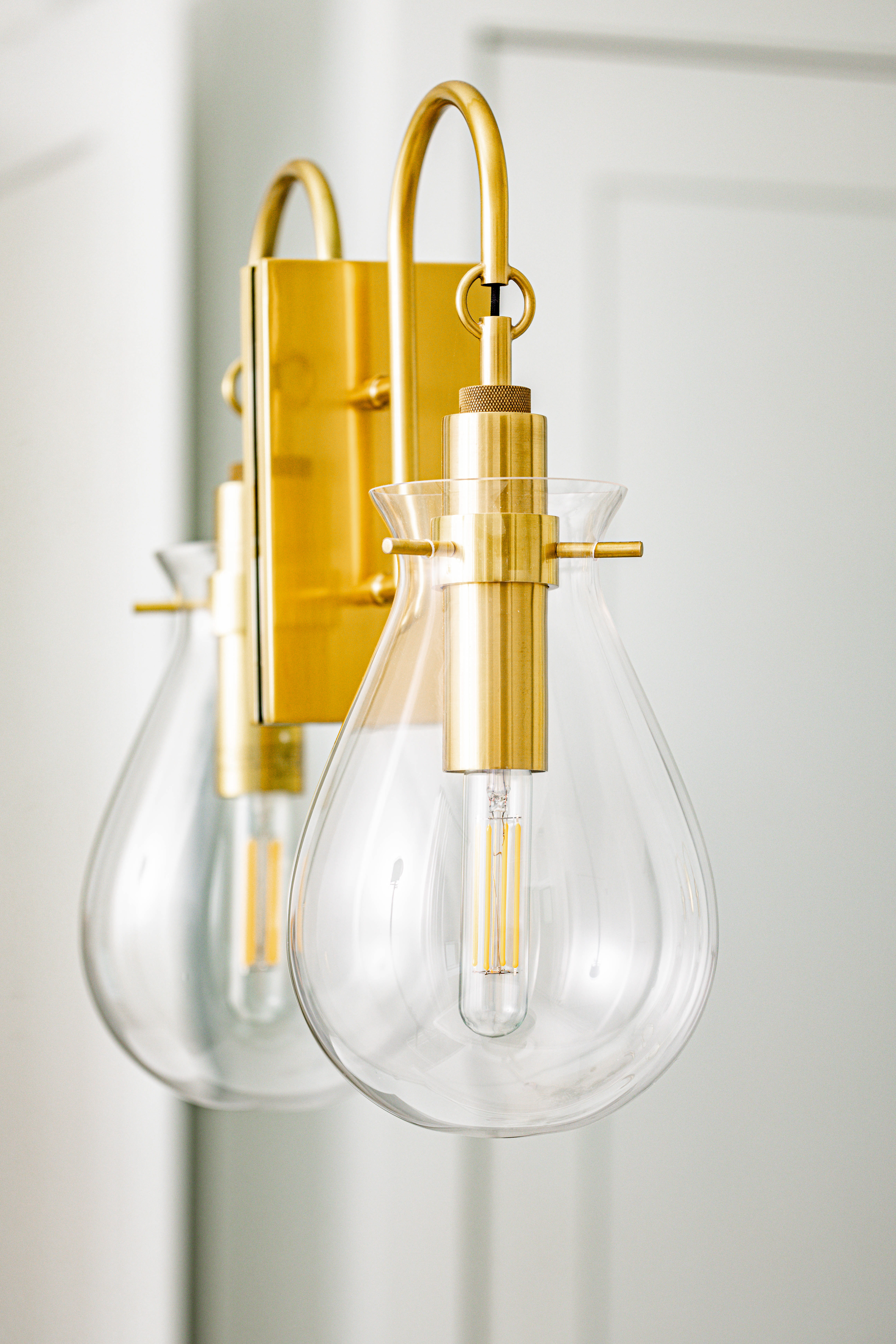 detail photo of a gold Edison bulb light fixture