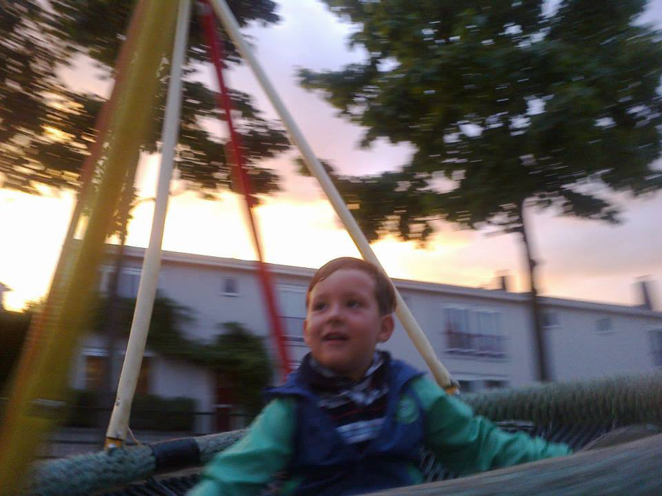 in a swing in a playground in Amsterdam north