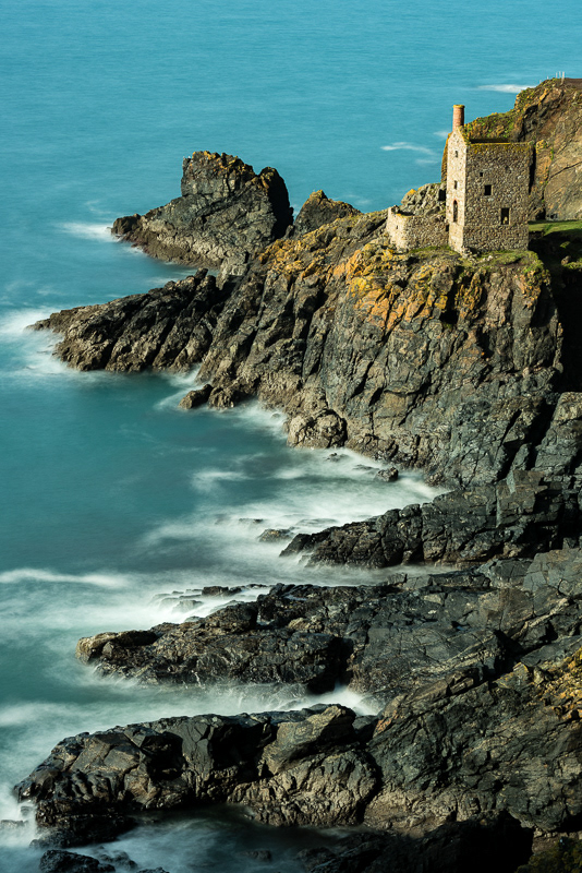 The Crowns engine house sitting at the foot of the cliffs at Botallack Tin Mines, Cornwall.