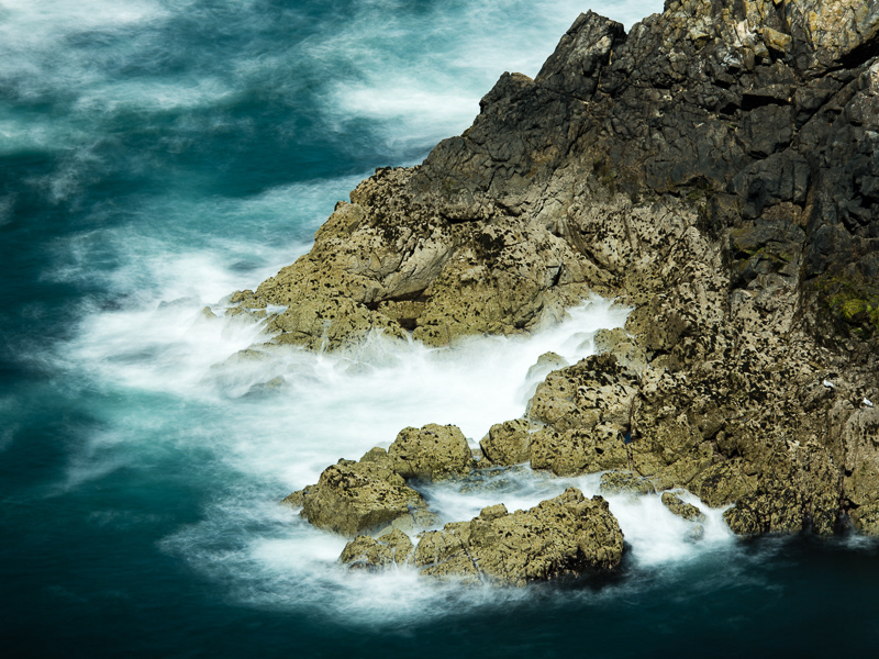 A long exposure of waves crashing against the Garland Stone off Skomer Island, Pembrokeshire, Wales.