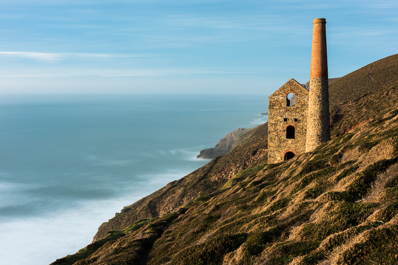 Golden light hitting Towanroath engine house at sunset at Wheal Coates, Cornwall.