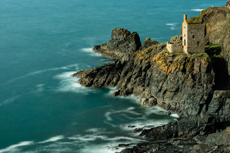 The Crowns engine house at the base of the cliff at Botallack Tin Mines, Cornwall.