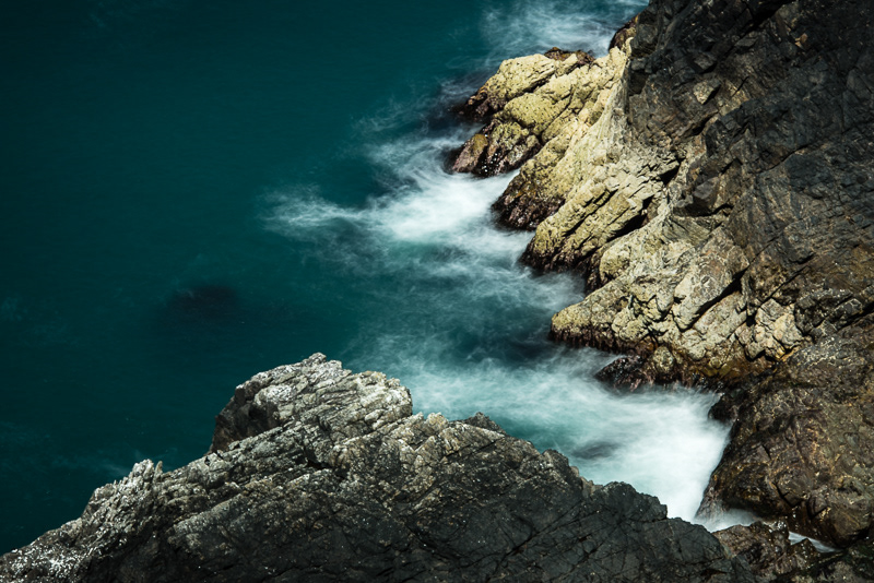 A long exposure of waves crashing into a cove on Skomer Island, Pembrokeshire, Wales.