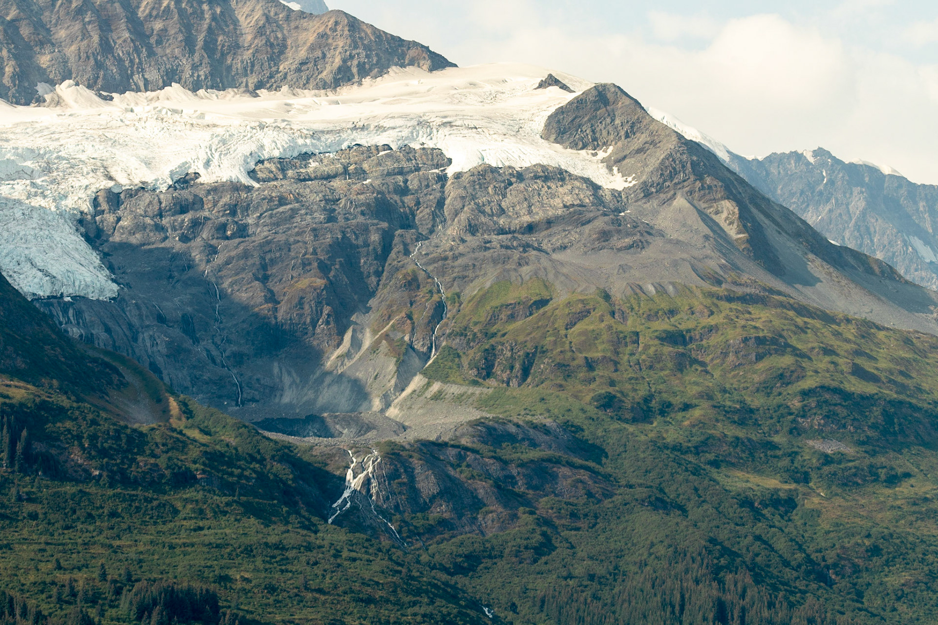 One of the many valley glaciers in College Fjord. These differ from the Tide Water glaciers in that they do not terminate at the sea, but instead seem to hang on the side of the mountains. College Fjord was discovered in 1899 during the Harriman Expedition, at which time the glaciers were named. The expedition included a Harvard and an Amherst professor, and they named many of the glaciers after elite colleges. According to Bruce Molina, author of Alaska's Glaciers, "They took great delight in ignoring Princeton.
