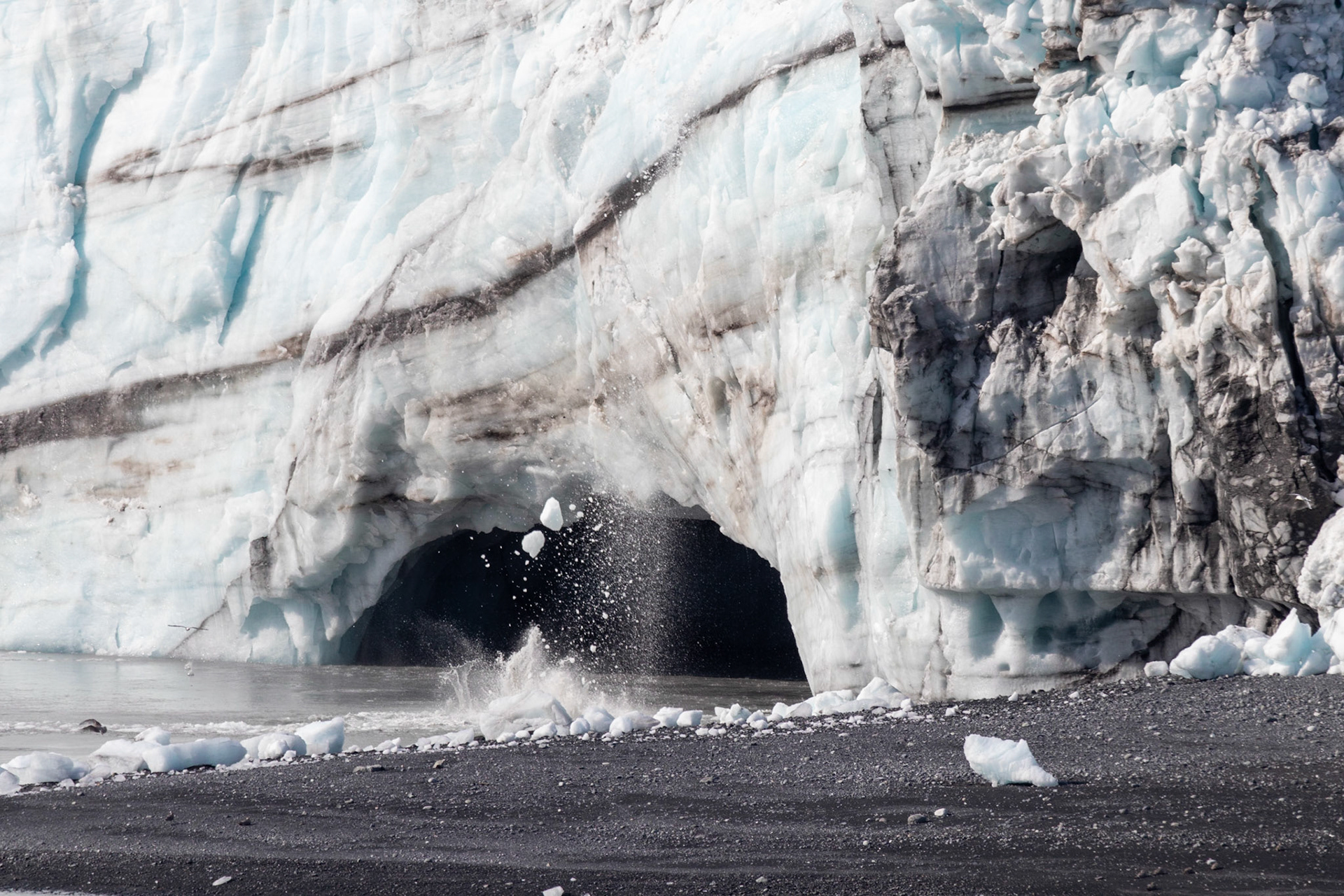 Ice falling from the Margerie glacier as it calves, melts, and splits.