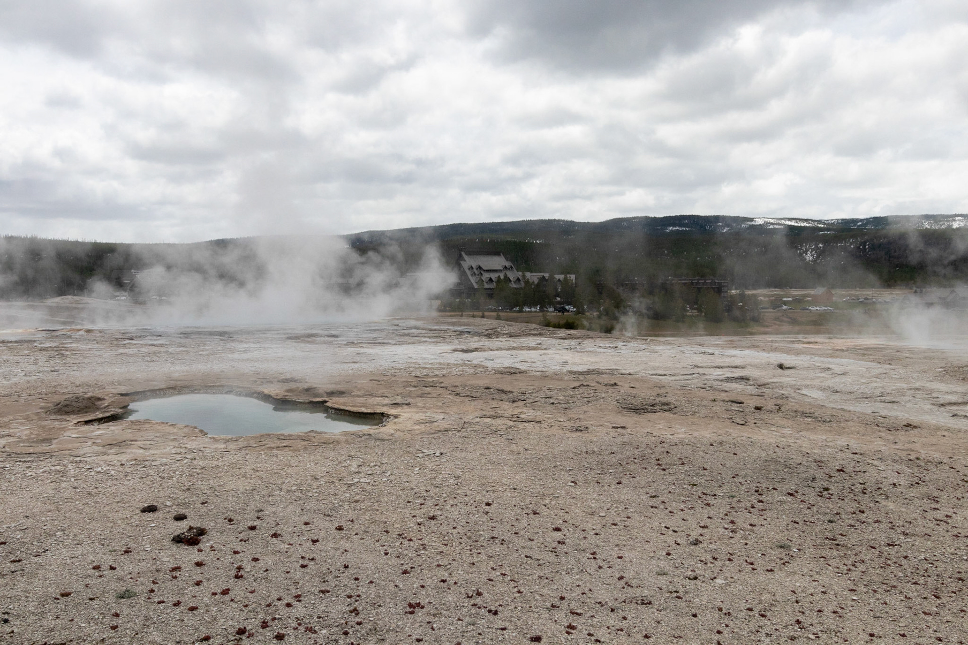 Old Faithful Lodge in the background of the Upper Geyser Basin.