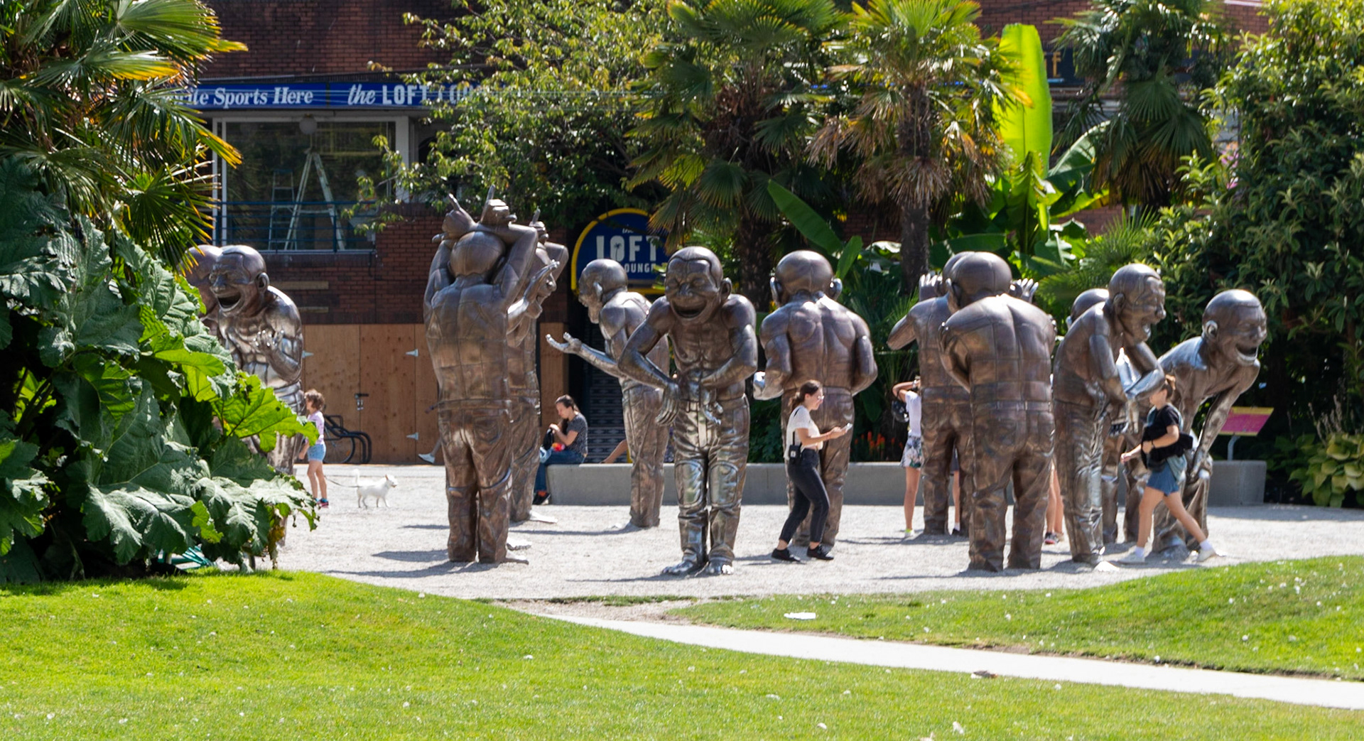 This outdoor work by Beijing-based artist Yue Minjun depicts 14 cheerful sculptures of himself. Many visitors try to recreate the poses of the sculptures.