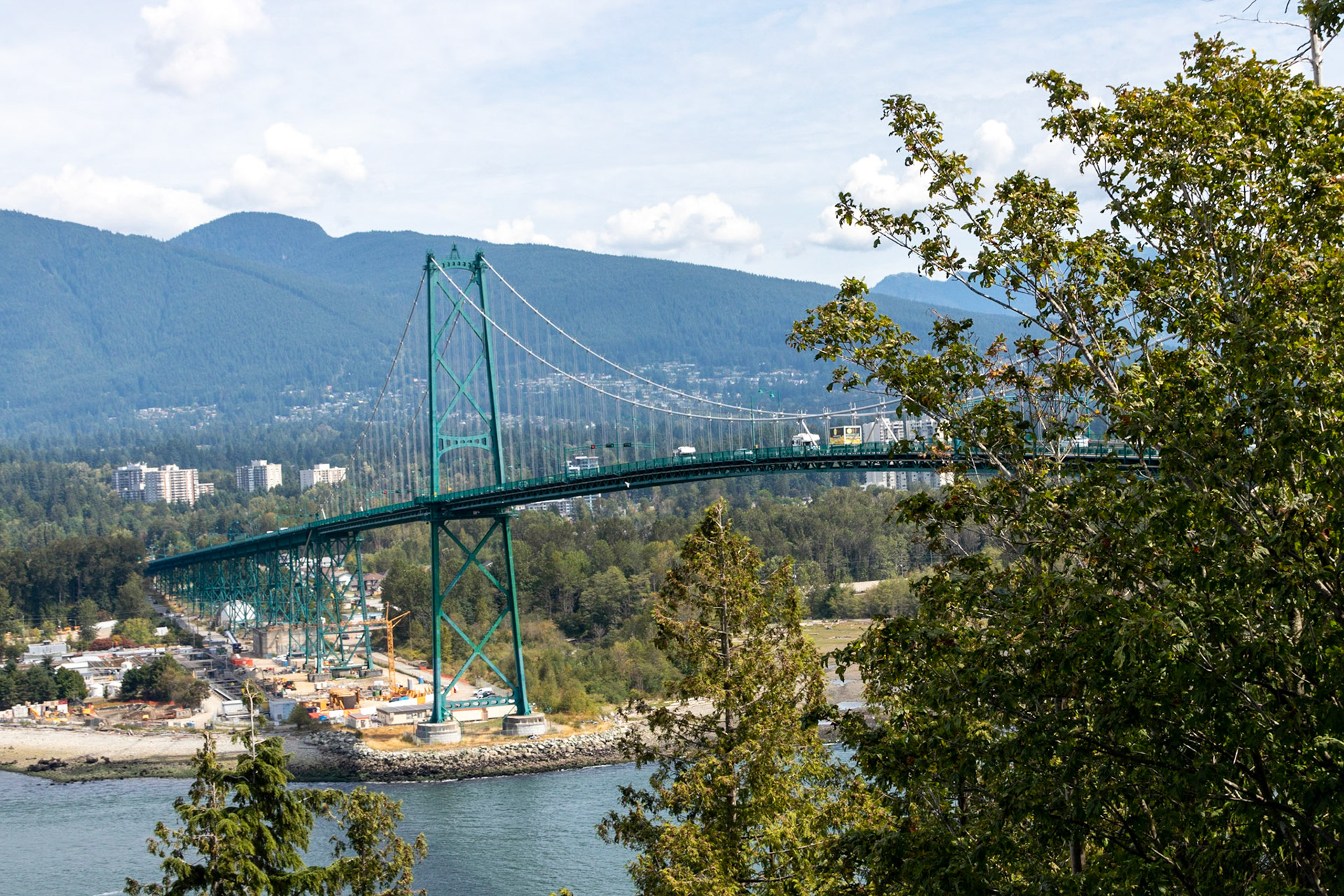 A view of the Lion's gate bridge from an obersvation point within Stanley Park. The Lion's gate bridge was designed by the same people who did the Golden Gate Bridge.