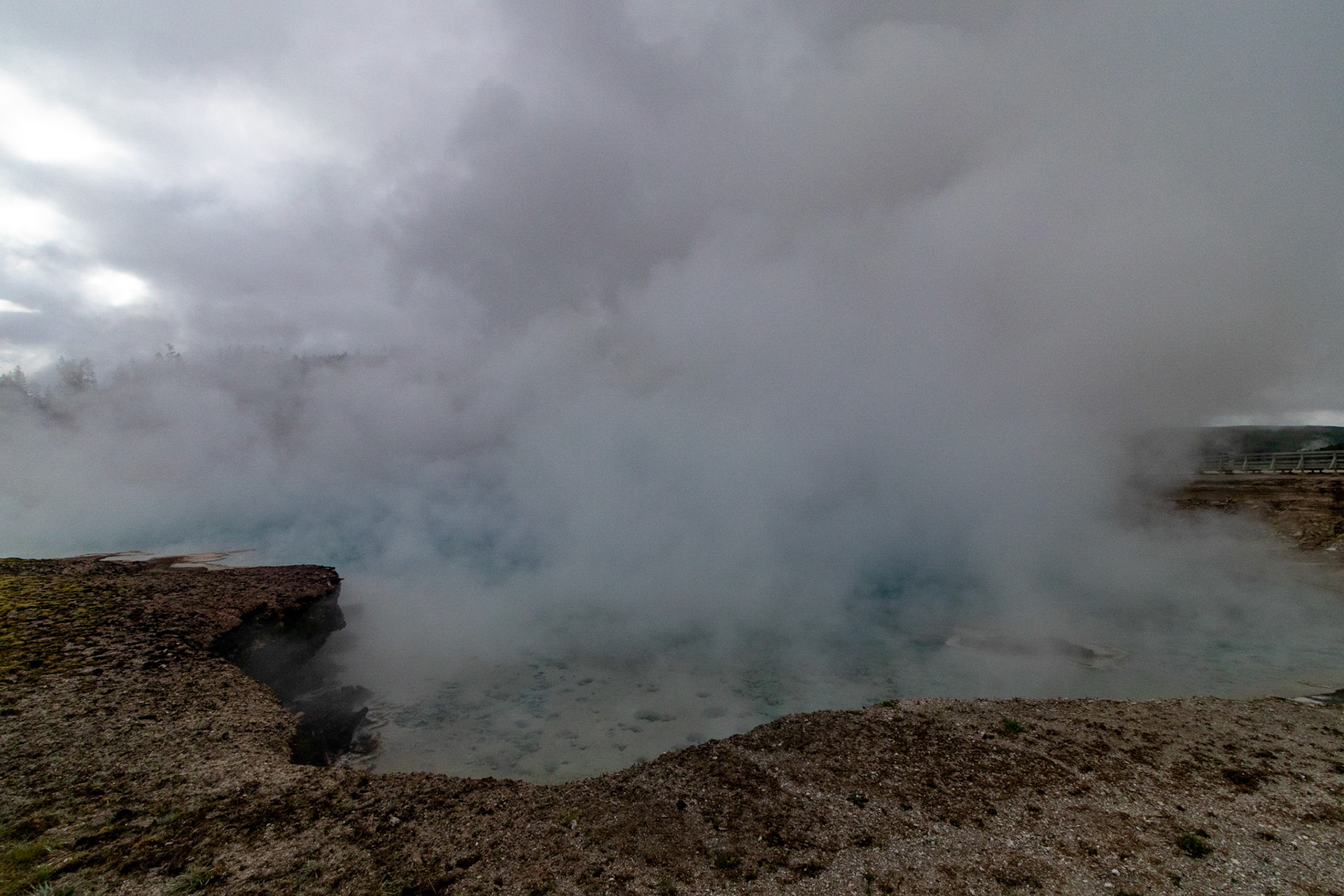 The Excelsior Geyser remains shrouded in steam most of the day