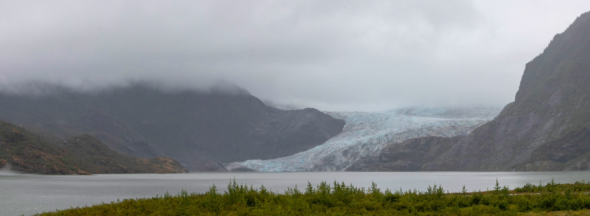 A panoramic shot of the Mendenhall Glacier. The Glacier is currently about 13 miles long, but 50 years ago it filled the entire valley that is now the lake you see I front of the Glacier.