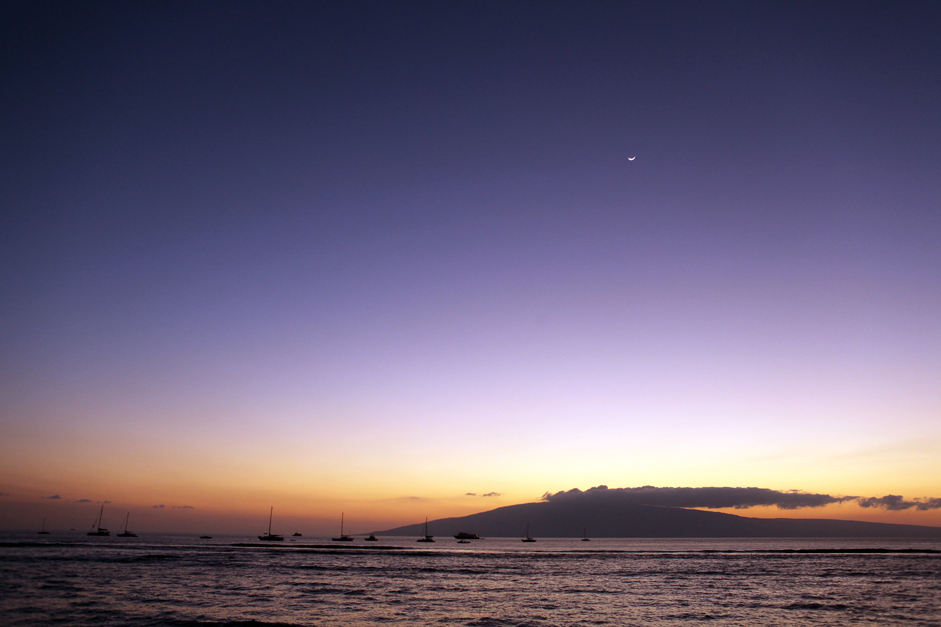 Island with sunset and moon Hawaii, USA