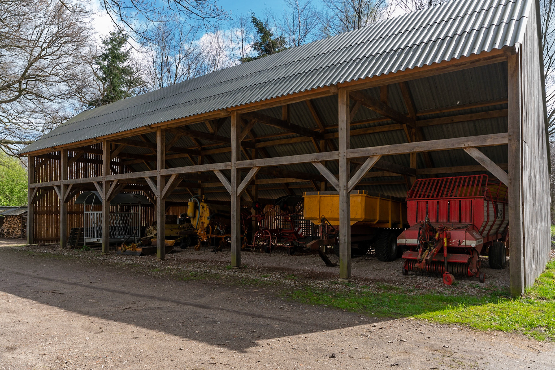 Farming equipment in an open barn near Ruurlo/Hengelo in The Netherlands.