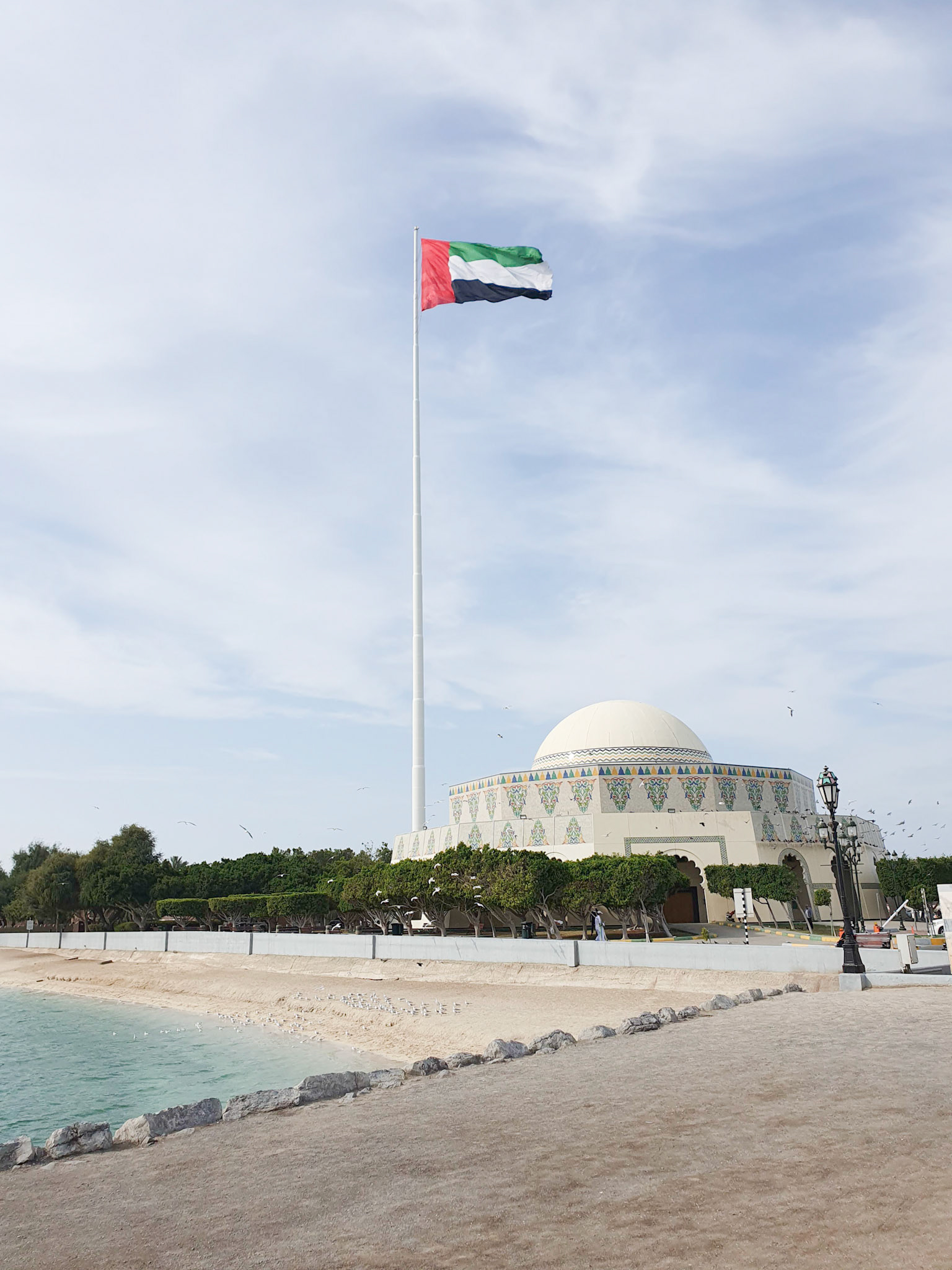 UAE Flag in Abu Dhabi (UAE) with Abu Dhabi Theater - Emirates Heritage Club
