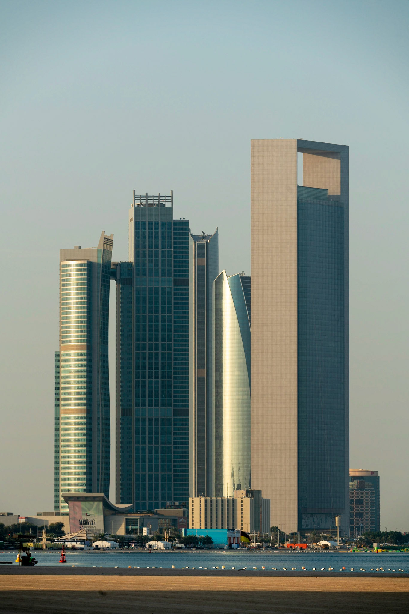 ADNOC HQ with CBD from Corniche beach in Abu Dhabi