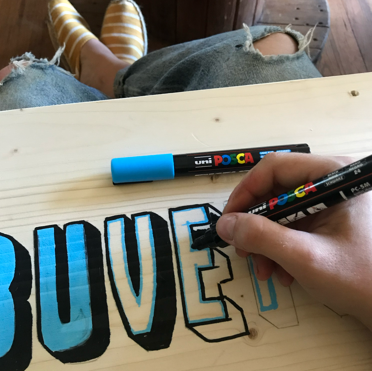 Enseigne peinte à la main