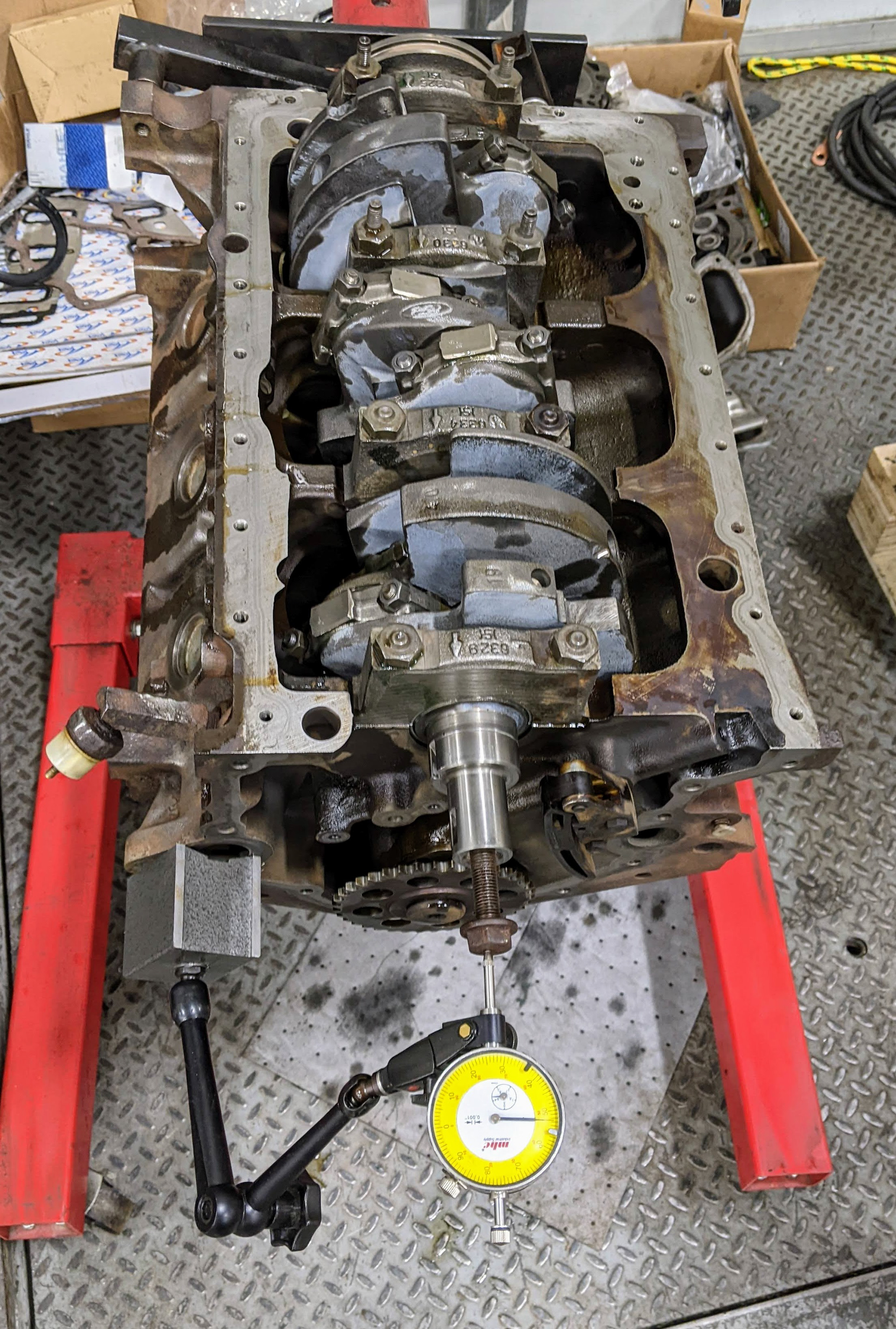 Checking endplay on the newly installed and refinished crankshaft.