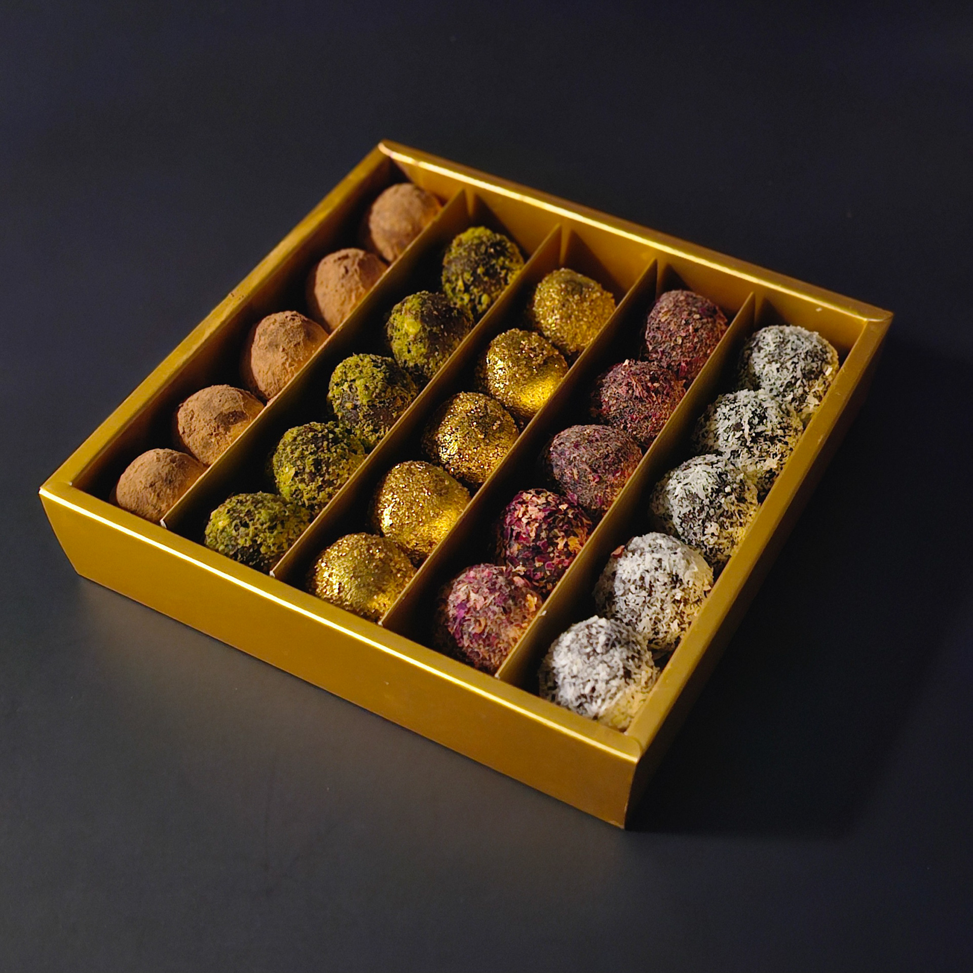 DAHAB DELIGHTS 25 DATE BITES, cocoa, coconut, pistachio, deep blossom water, and cardamom. $30