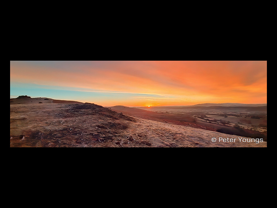 a stunning orange winter sunrise over Hope Bowdler Hill - Church Stretton