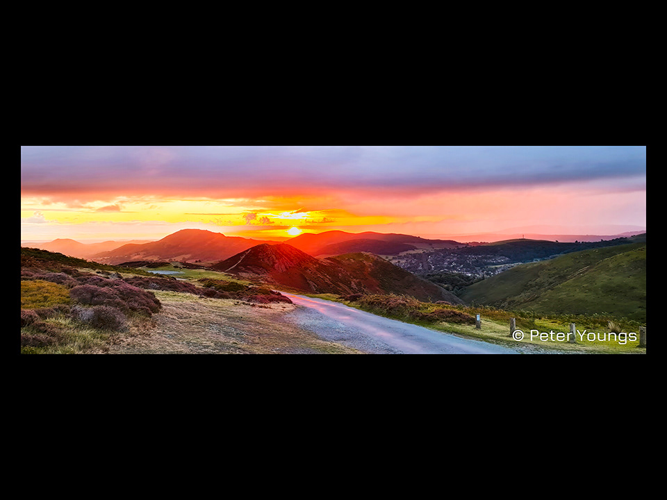 A fiery sunrise from the Top of the Burway looking down on Church Stretton