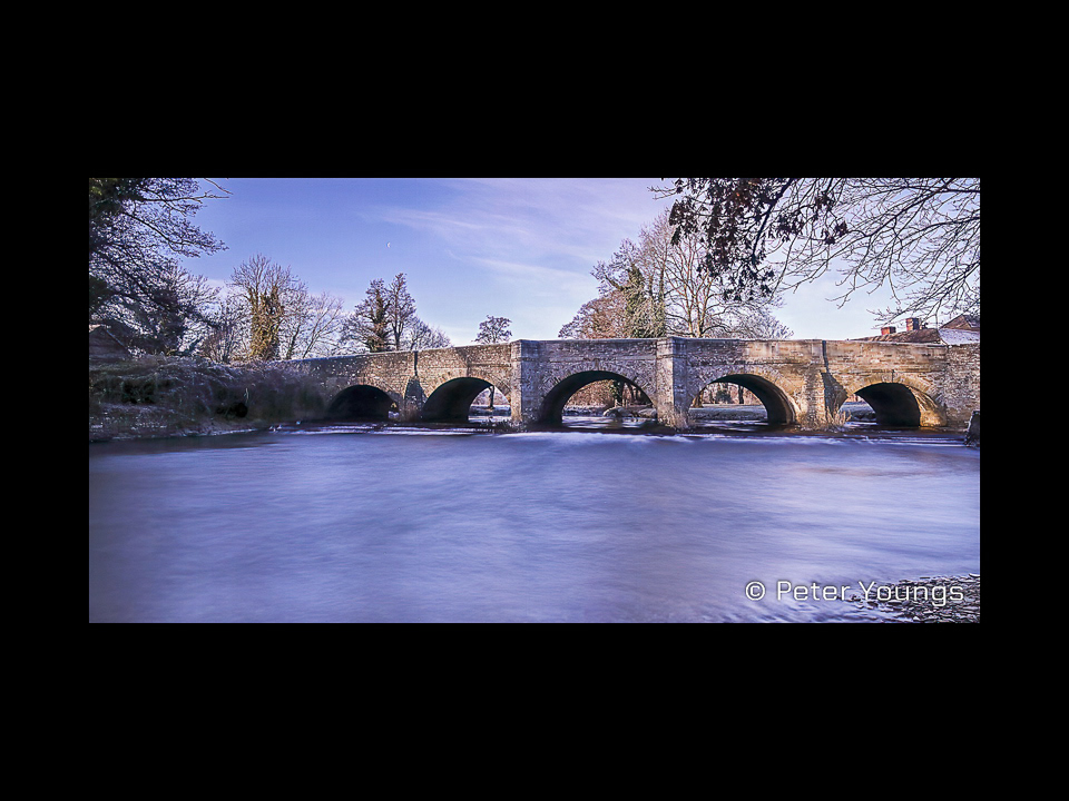 A long exposure image of The Bridge at Leintwardine on a Cold Winter's Morning