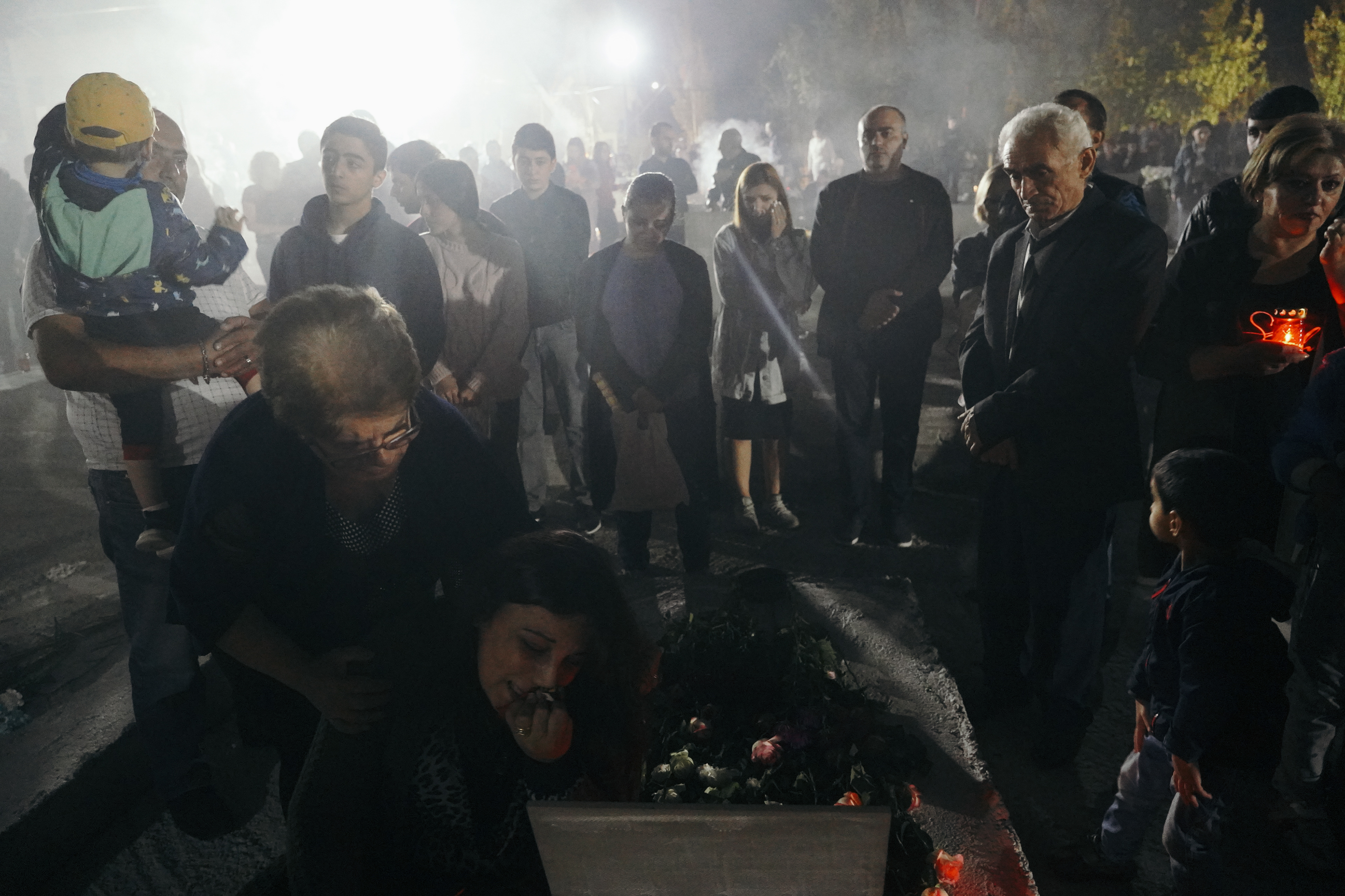 Mourners gather at Yerablur Military Pantheon military cemetery to commemorate Armenian service members killed in a conflict over the region of Nagorno-Karabakh on the eve of the first anniversary of conflict escalation in Yerevan, Armenia September 26, 2021. REUTERS/Artem Mikryukov