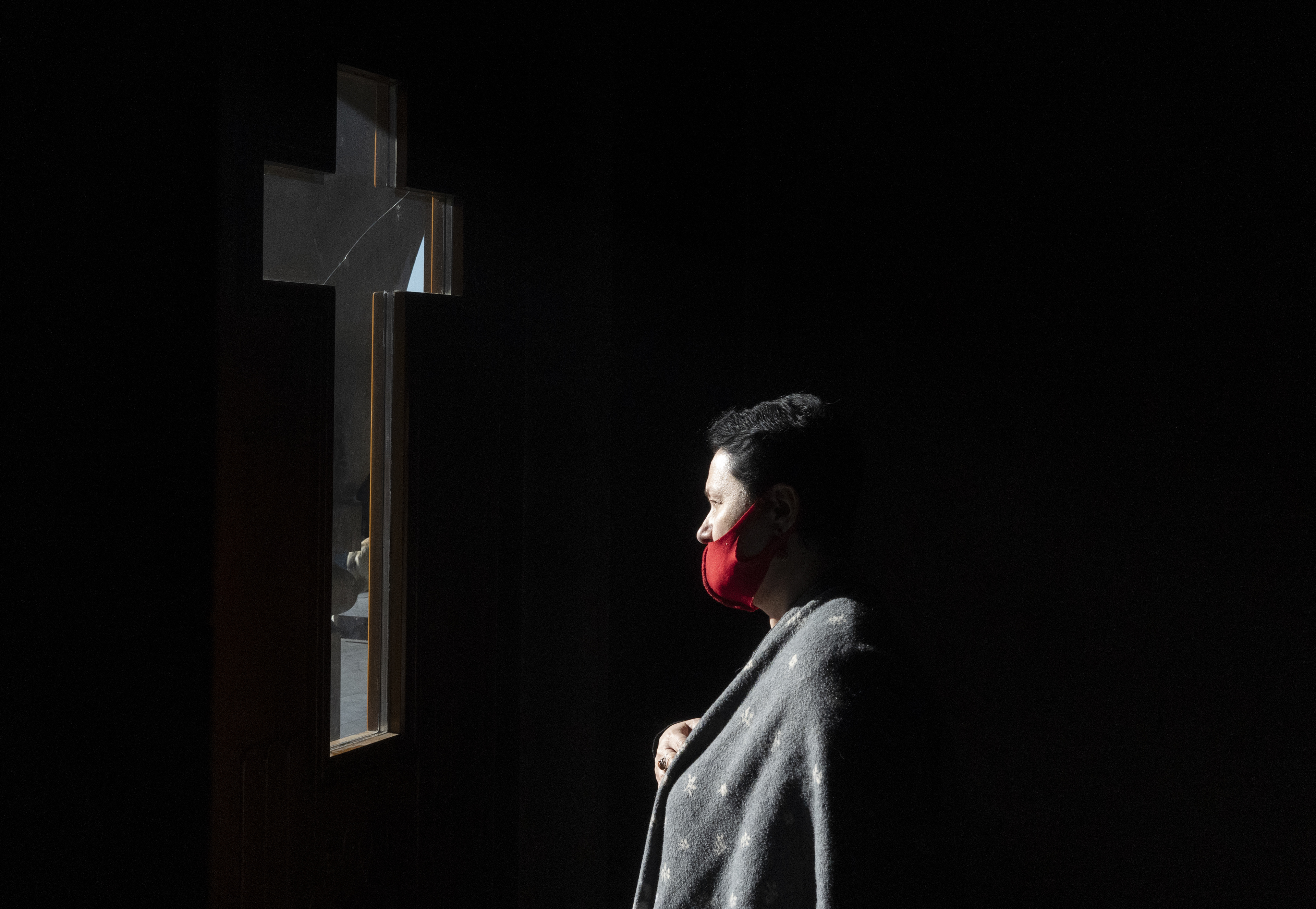 A believer wears a protective face mask, used as a preventive measure against the spread of the coronavirus disease (COVID-19), in a church in Yerevan, Armenia November 8, 2020. Picture taken November 8, 2020. REUTERS/Artem Mikryukov