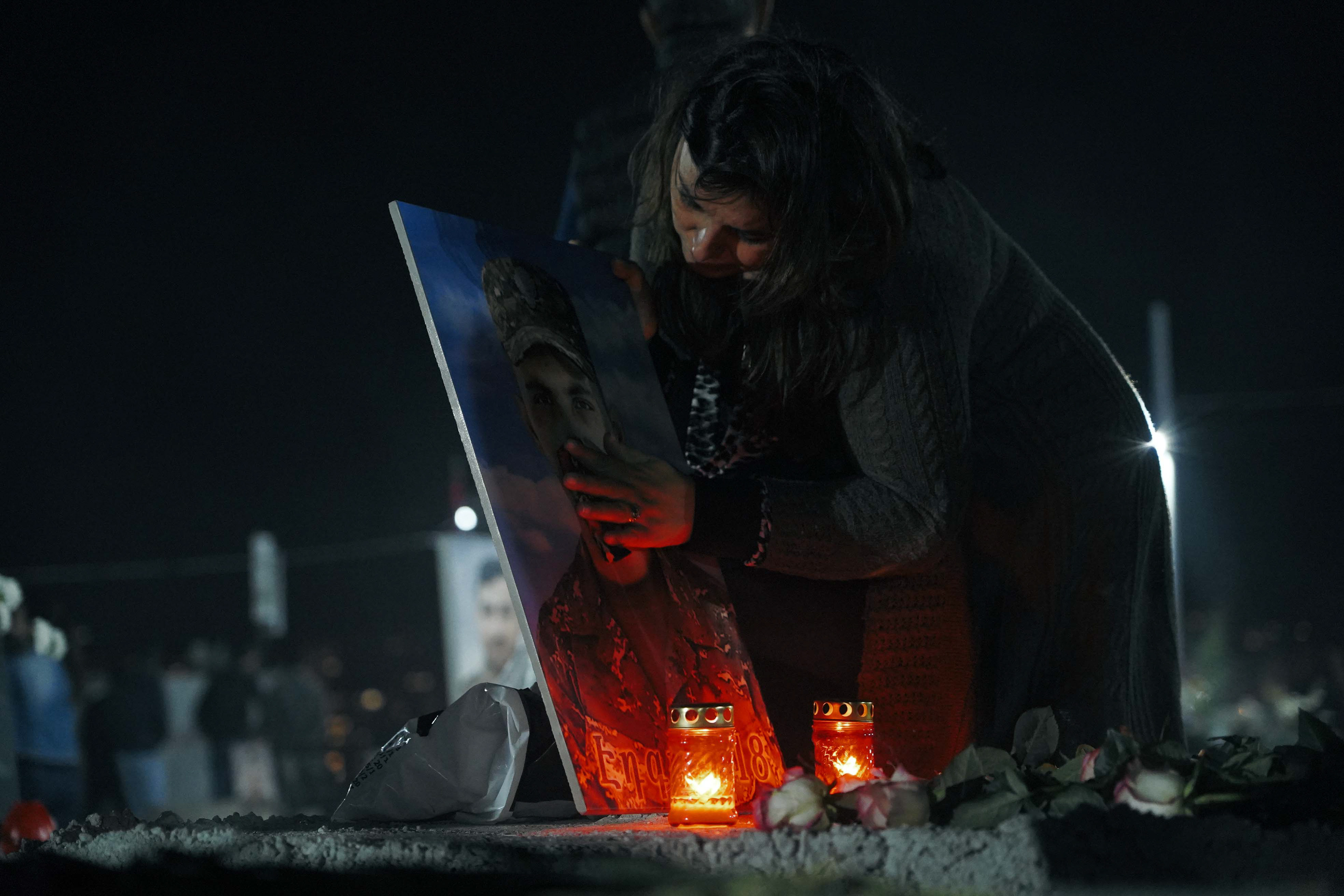 Mourners gather at Yerablur Military Pantheon military cemetery to commemorate Armenian service members killed in a conflict over the region of Nagorno-Karabakh on the eve of the first anniversary of conflict escalation in Yerevan, Armenia September 26, 2021. REUTERS/Artem Mikryukov