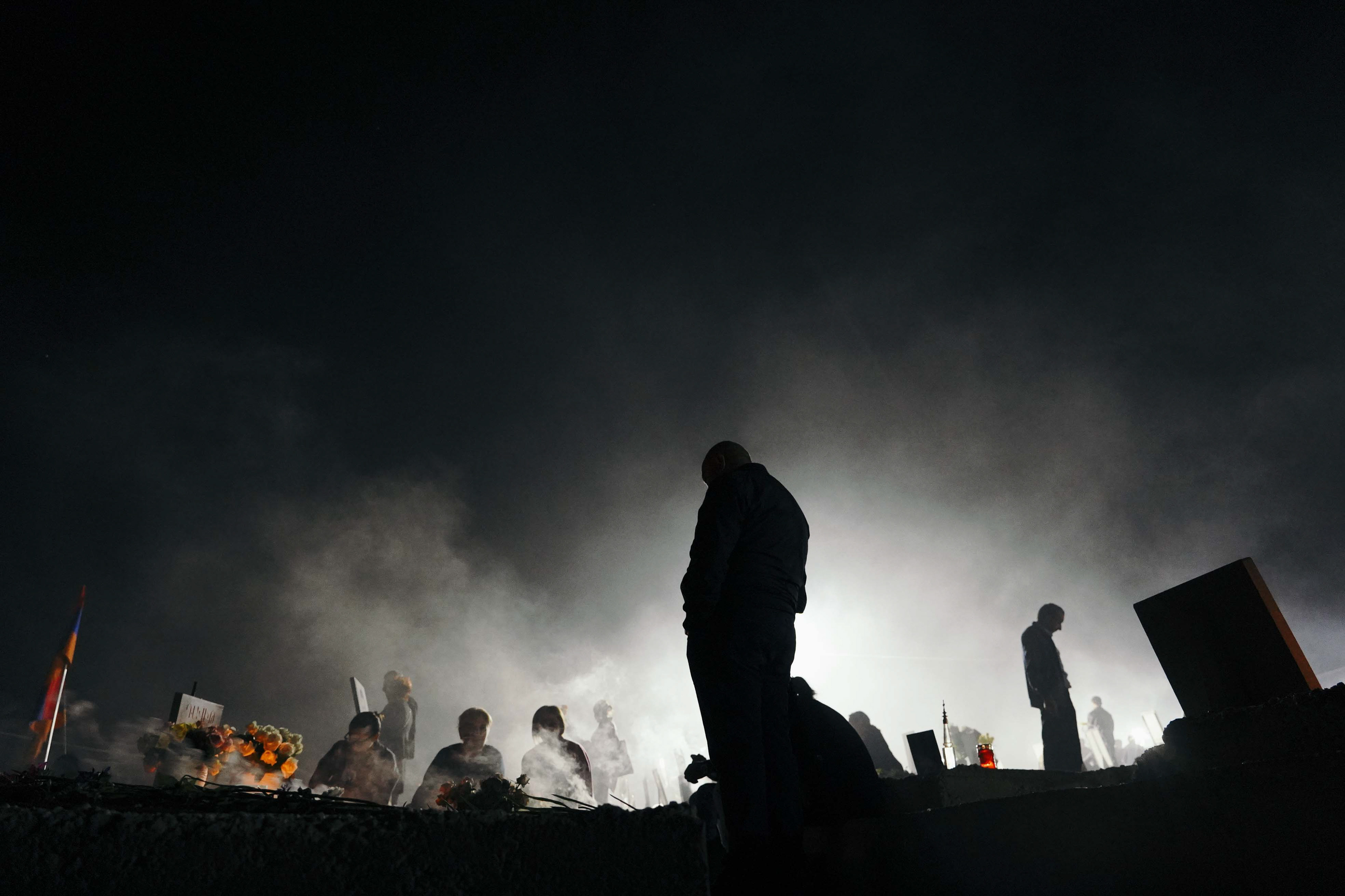Mourners gather at Yerablur Military Pantheon military cemetery to commemorate Armenian service members killed in a conflict over the region of Nagorno-Karabakh on the eve of the first anniversary of conflict escalation in Yerevan, Armenia September 26, 2021. REUTERS/Artem Mikryukov