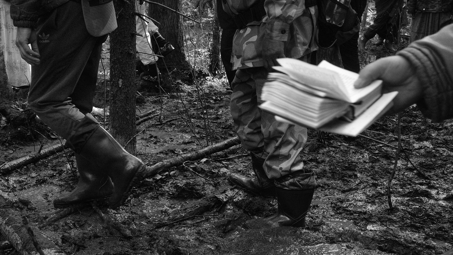 A pilgrim reads the bible on the move during the procession