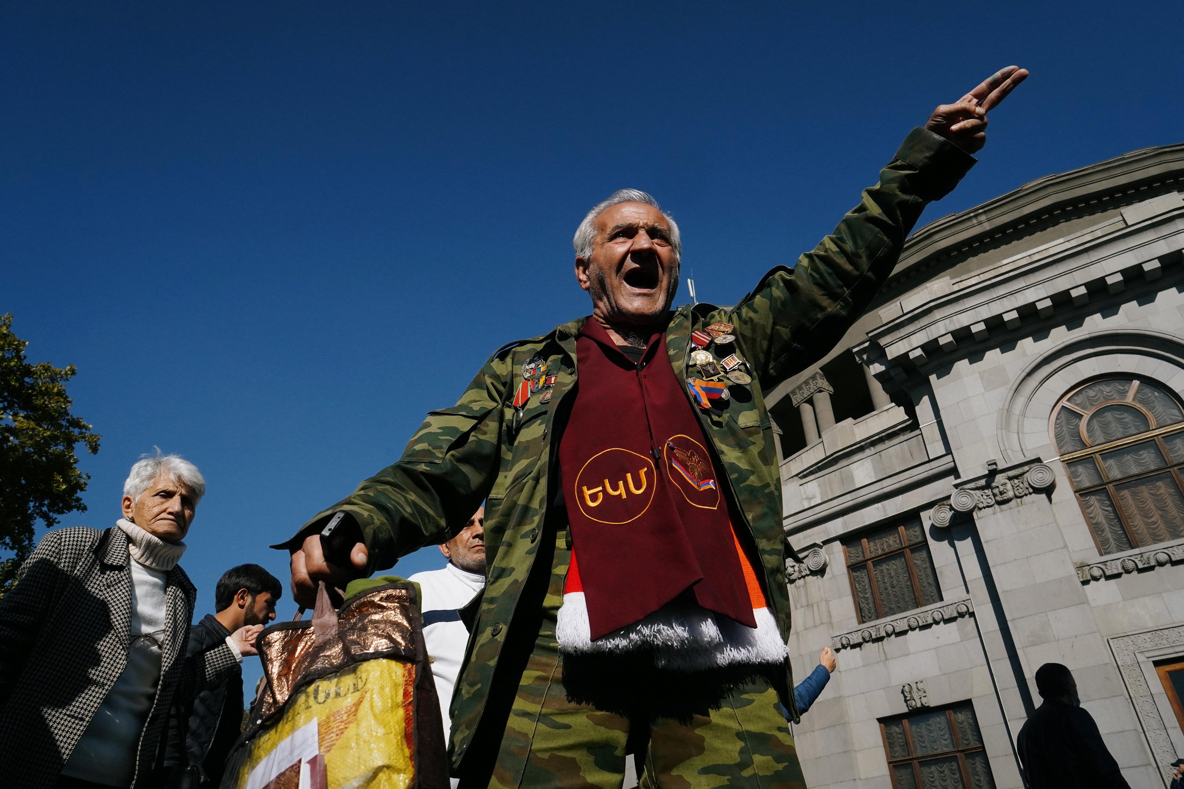 A man gestures and shouts during an opposition rally to demand the resignation of Armenian Prime Minister Nikol Pashinyan following the signing of a deal to end the military conflict over the Nagorno-Karabakh region, in Yerevan, Armenia November 11, 2020. REUTERS/Artem Mikryukov