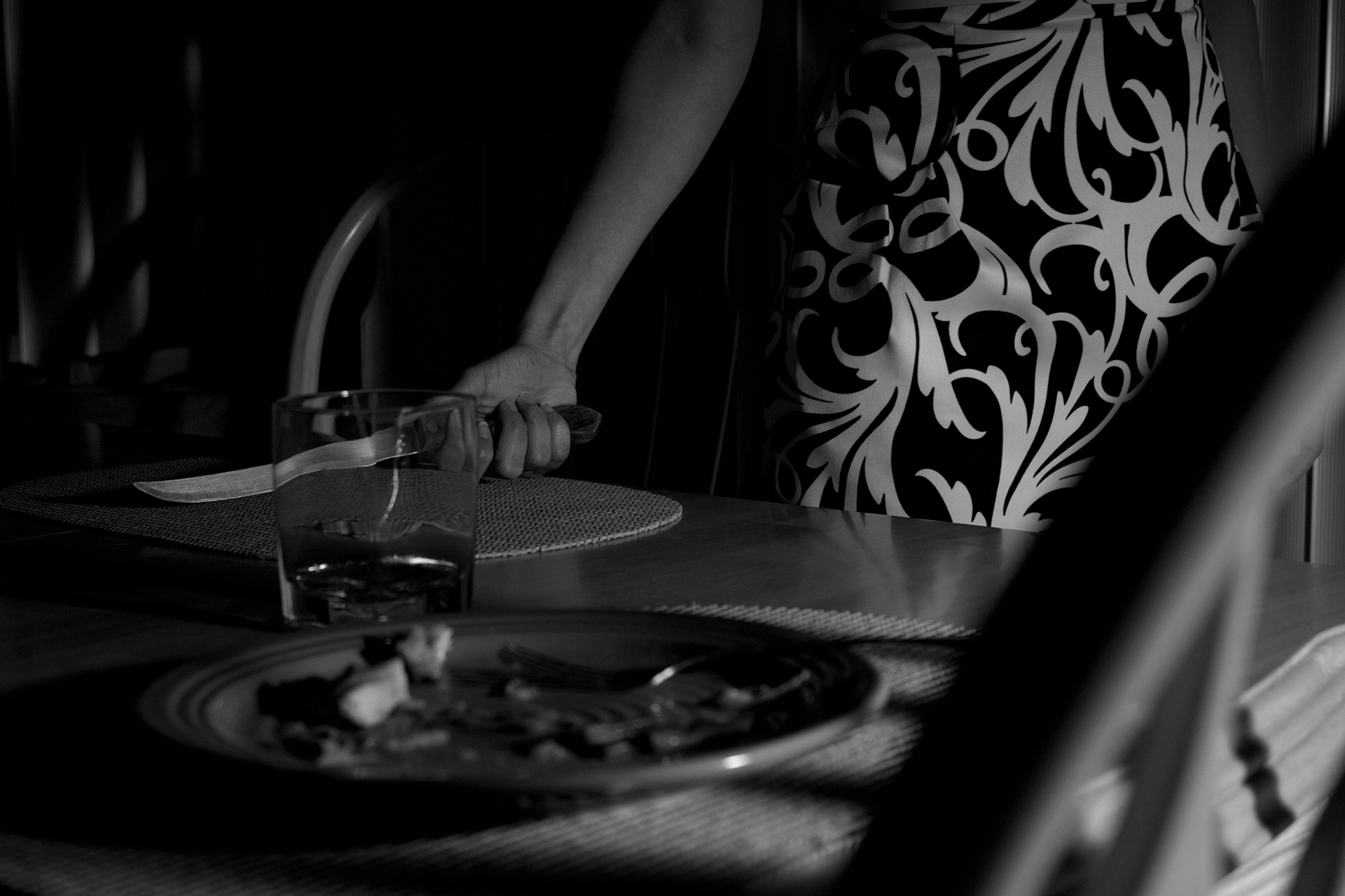 Part of a series of photos meant to mimic the film noire genre for my Digital Photography class. The idea here was to create a femme fatale character. I recreated the high contrast look of the genre by using a one light set up to create dramatic shadows. The image was converted to black & white in post processing. February 2011 | Canon Rebel T1i, Kit Lens